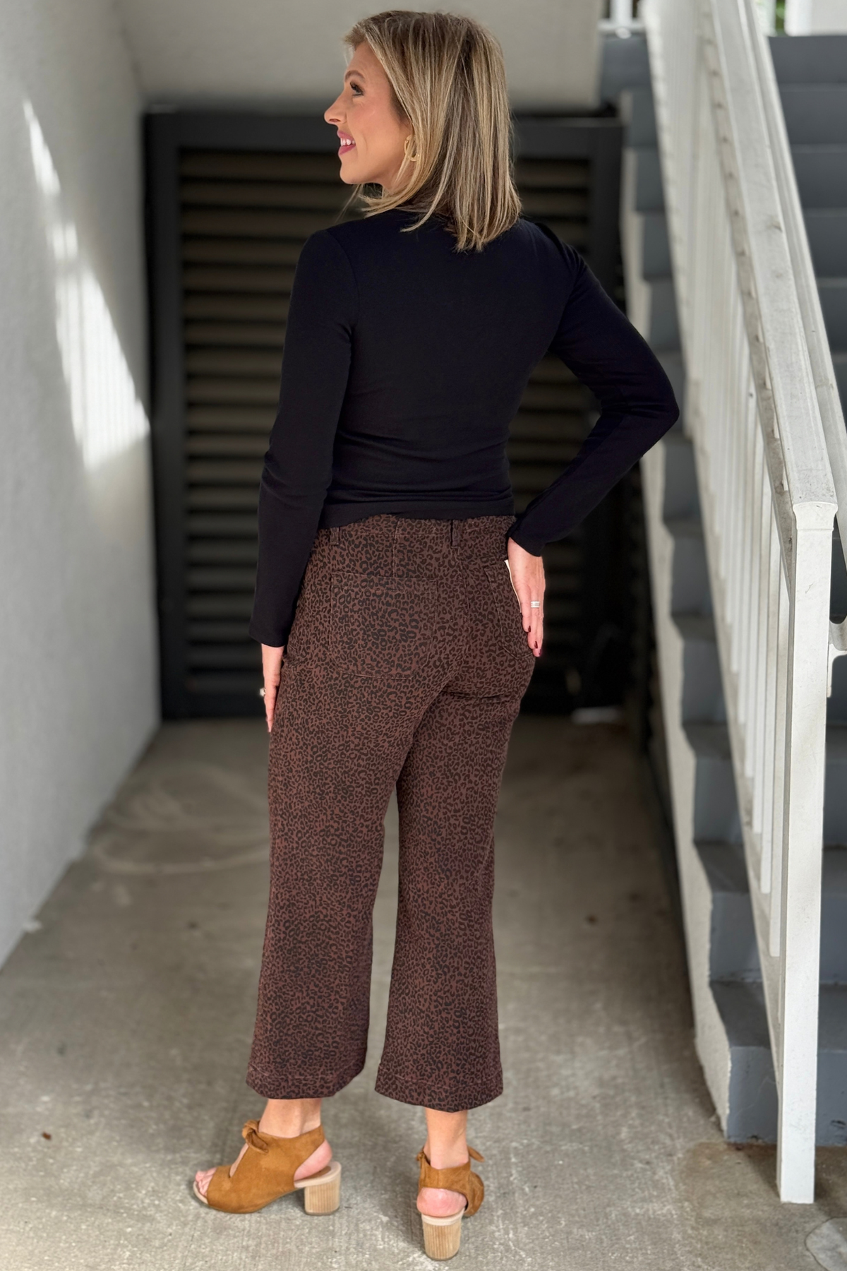 Back view of Charlie B brown leopard twill pants