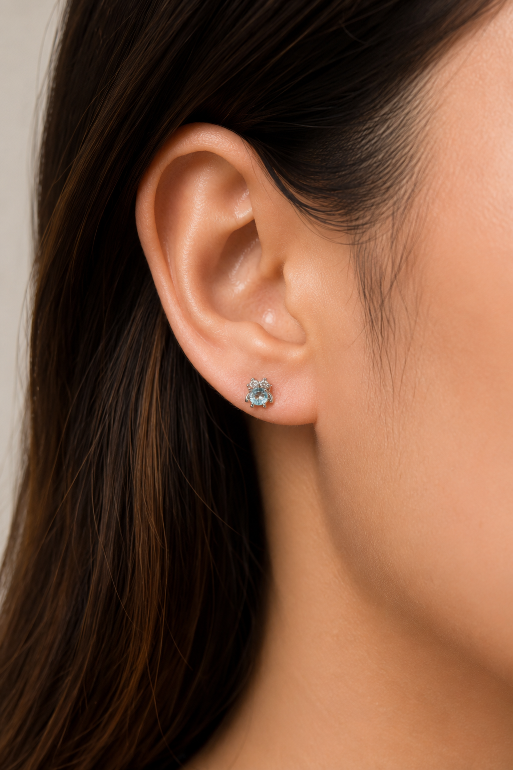 Fantasy Blue Moissanite Stud Earrings 1.0CT on model ear