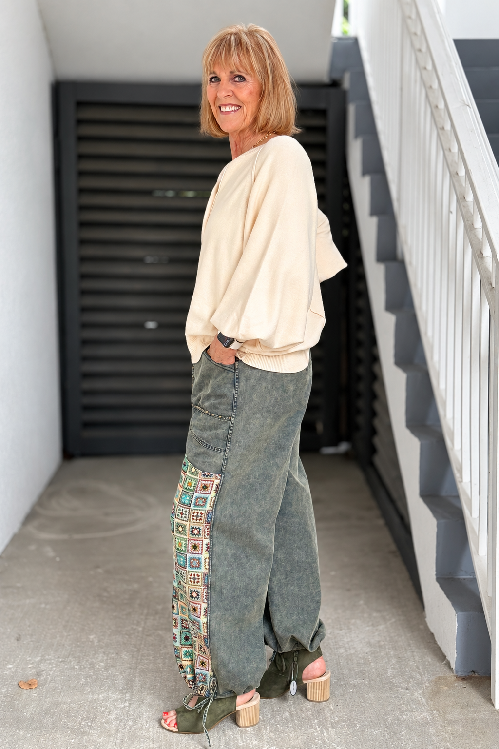 Olive mineral wash pants with colorful crochet side panels