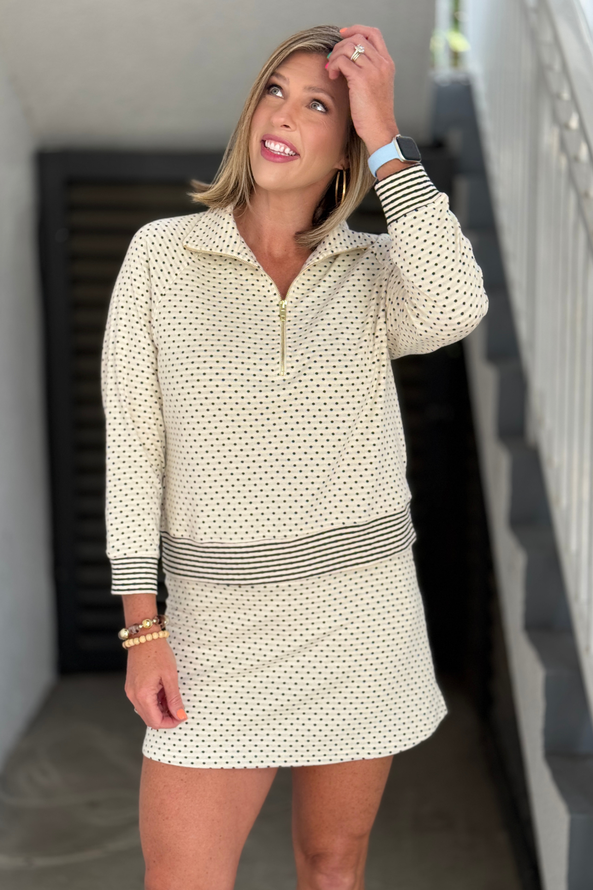Matching polka dot pullover and skort set