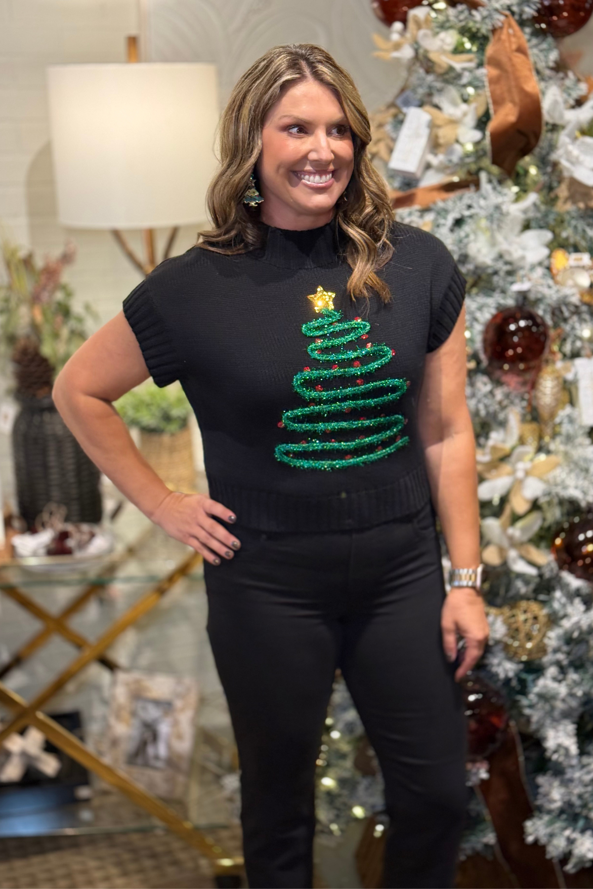 Black short sleeve sweater with embroidered glitter Christmas tree and gold star accent