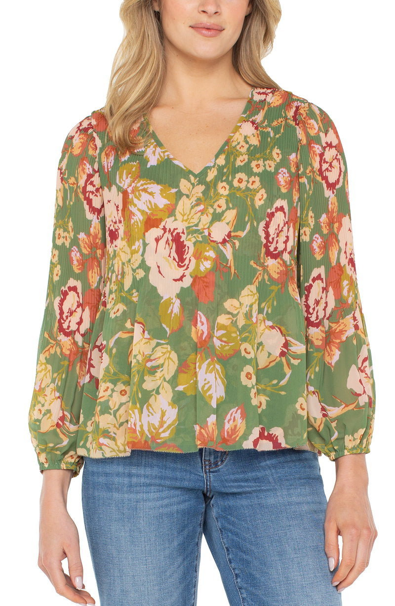 Close-up of Liverpool blouse showing pleated chiffon detail and floral print