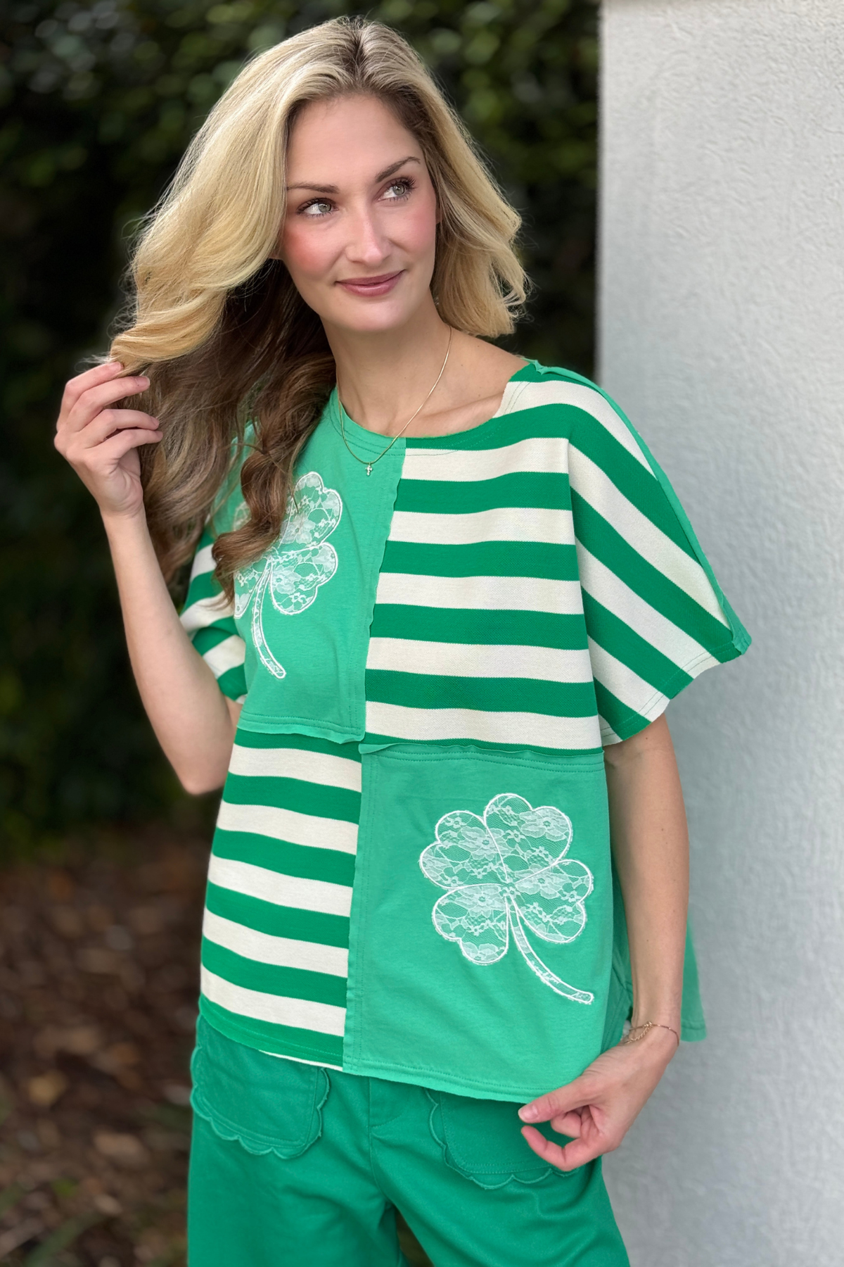Green patchwork top with clover lace embroidery detail