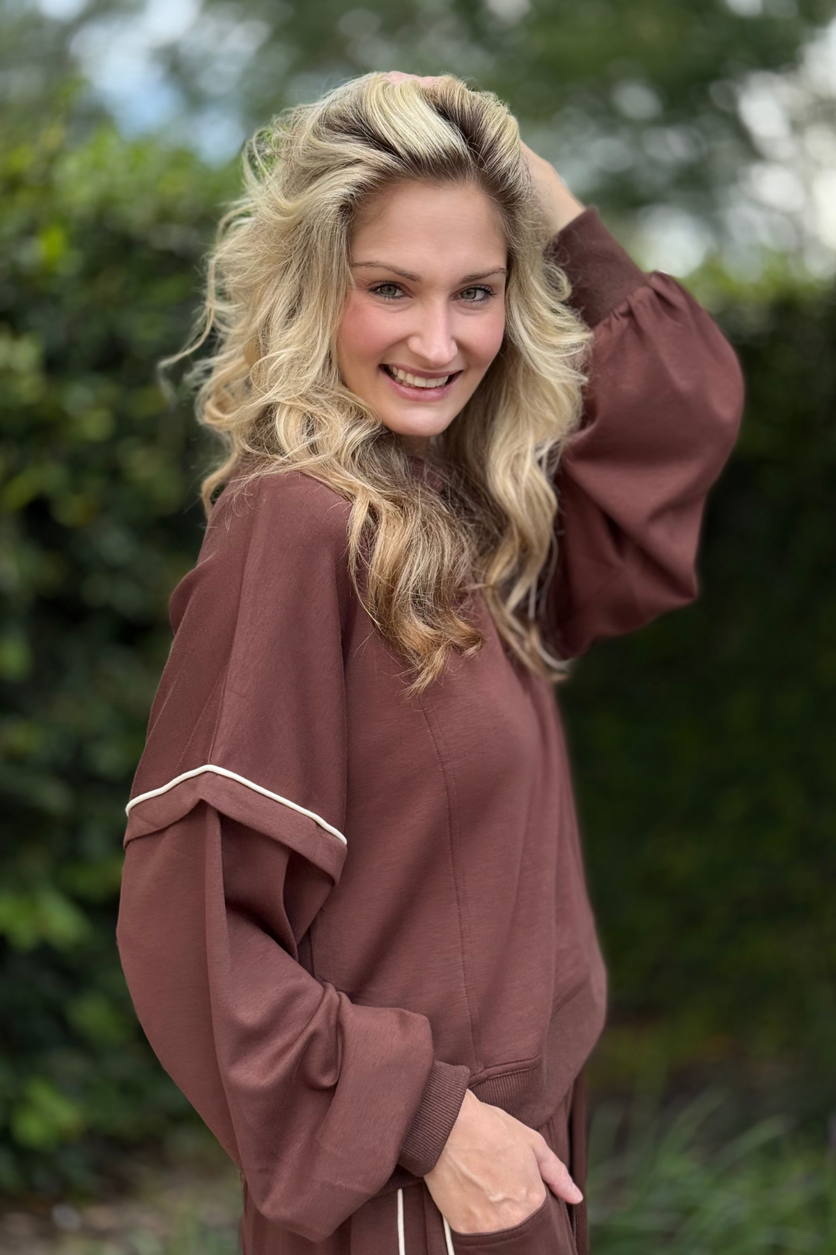 Side view of Cocoa Crush Mock Neck Sweatshirt showing relaxed fit and chic mock neckline