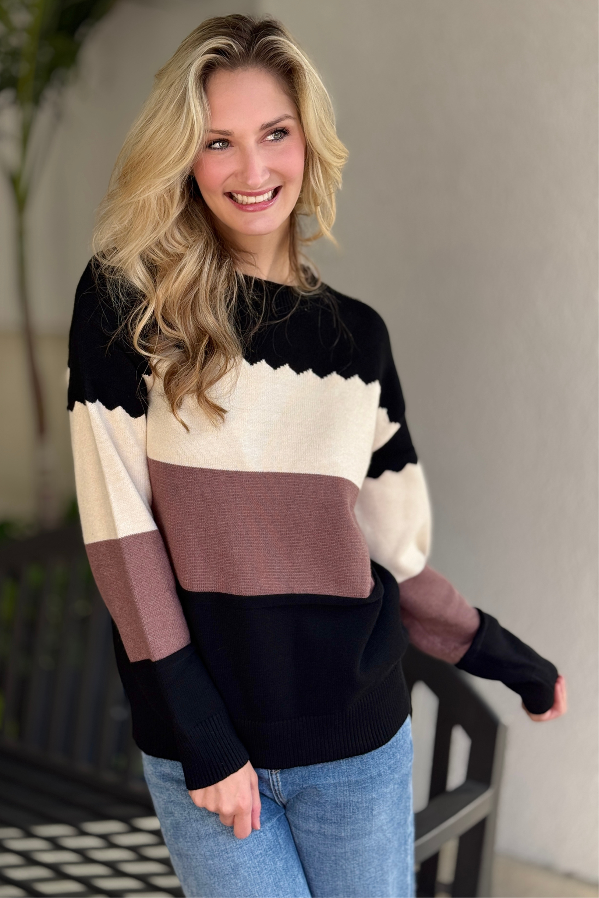 Casual colorblock crew neck sweater styled with denim