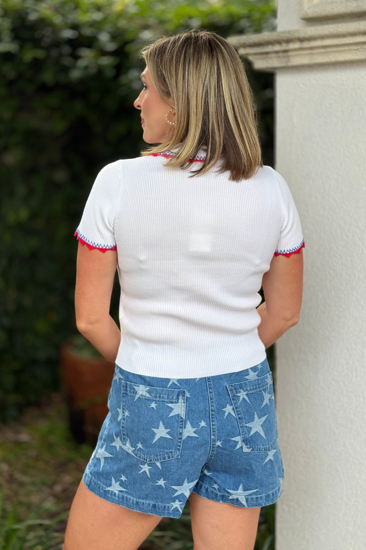 Boutique Americana polo top paired with denim shorts