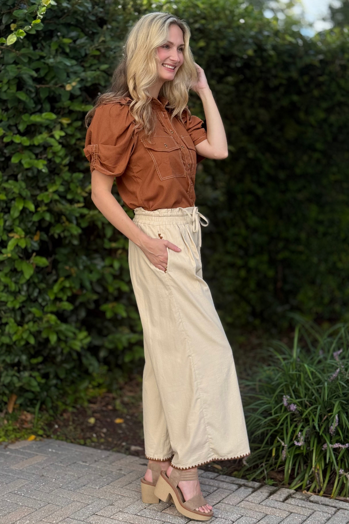 Wide-leg corduroy pants with decorative stitching detail at hem