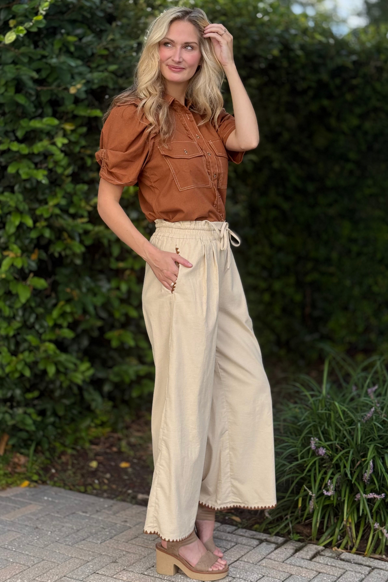 Model wearing relaxed fit beige corduroy pants with drawstring waist – Autumn Stitched Corduroy Pant