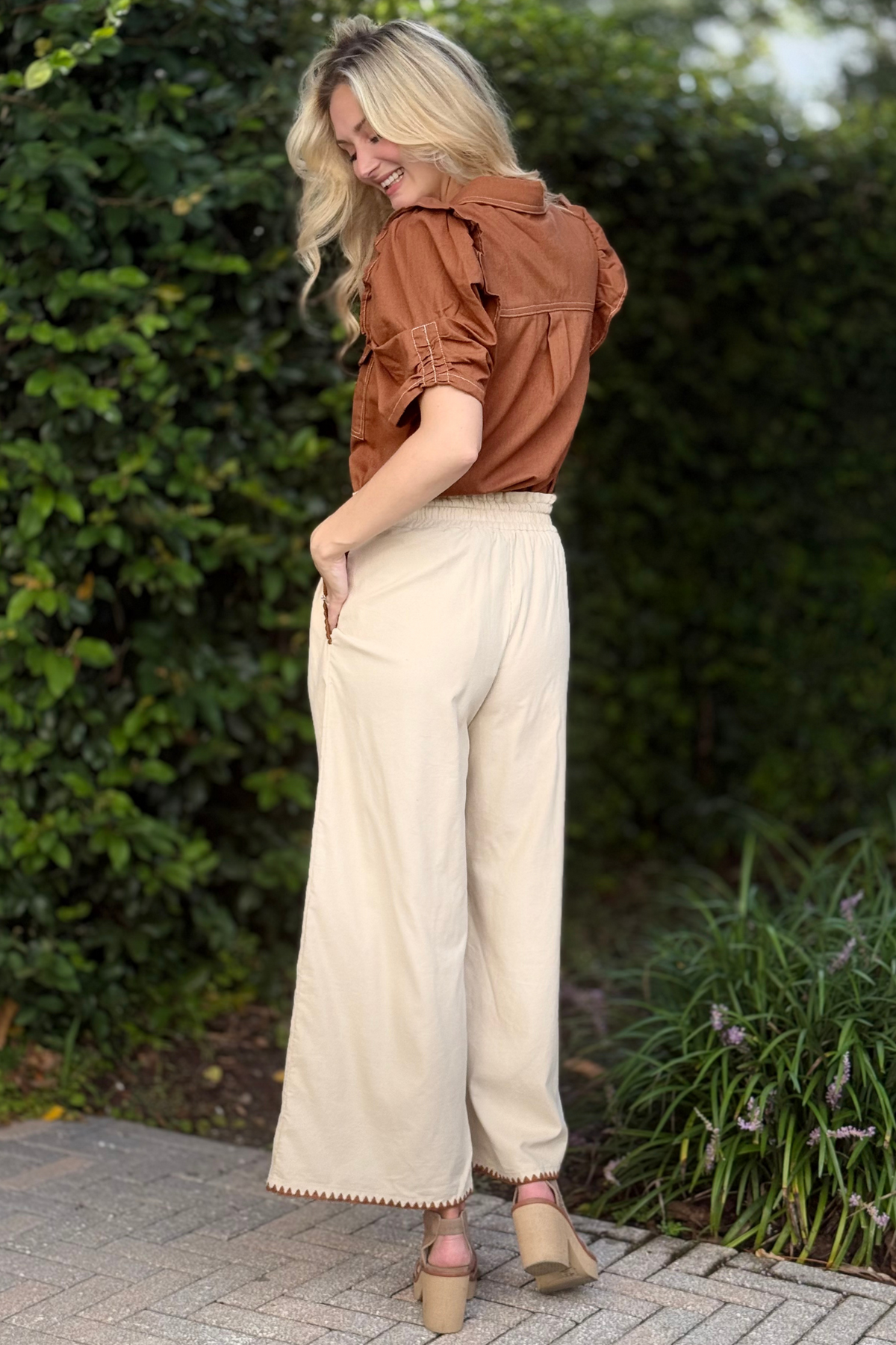Back view of relaxed fit corduroy pants with drawstring waist
