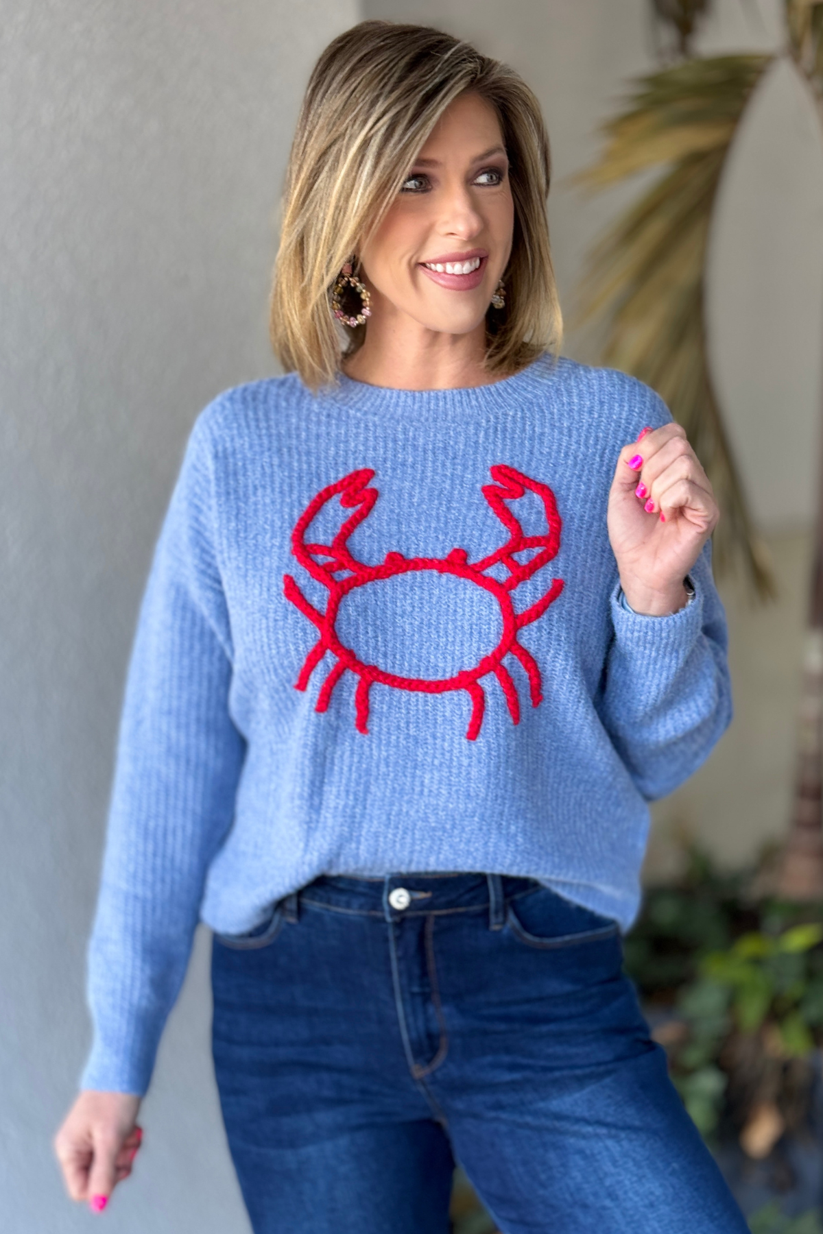 Blue chunky knit sweater with red crab embroidery