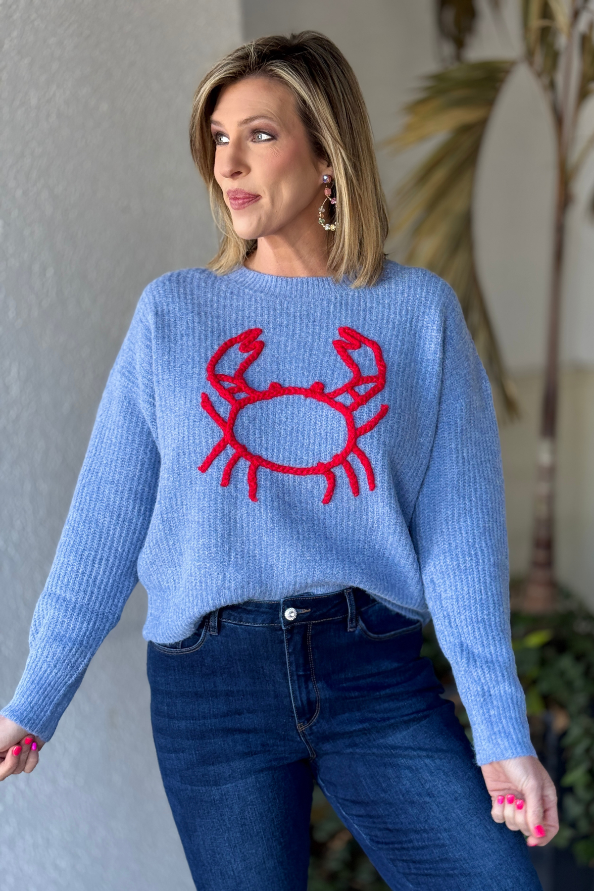 Relaxed fit blue nautical sweater styled with denim