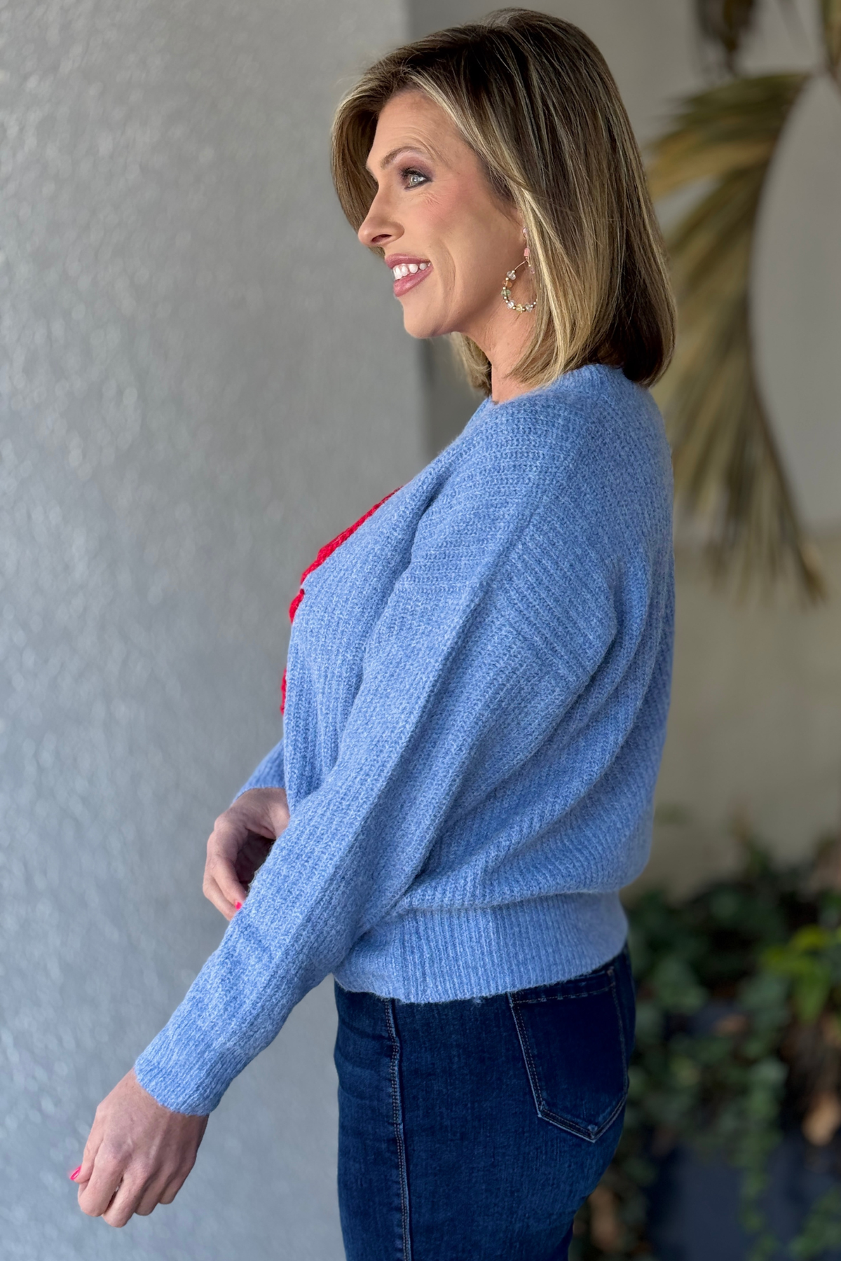 Front view of embroidered crab knit boutique sweater