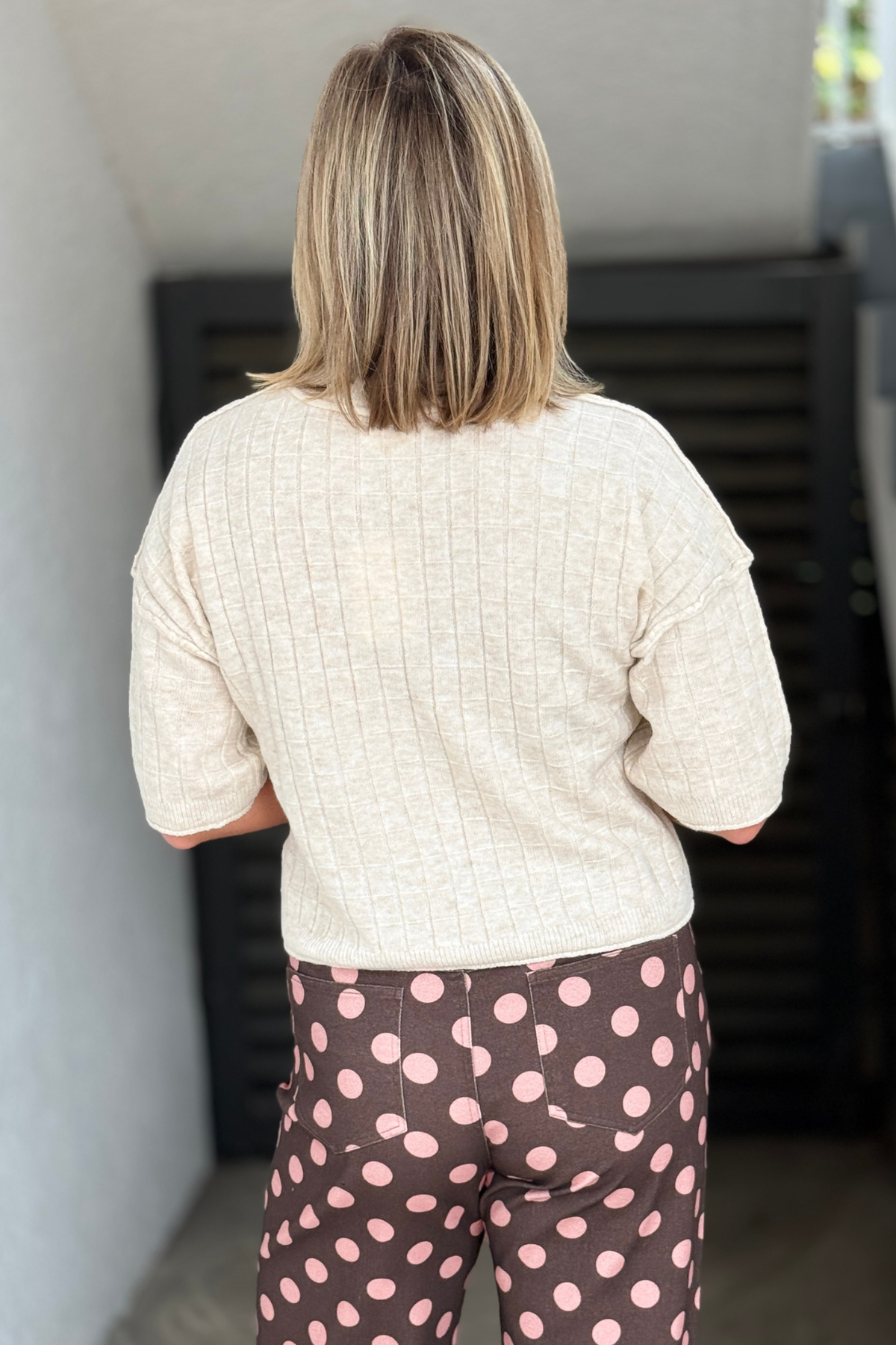 Lightweight cream sweater with ribbed texture