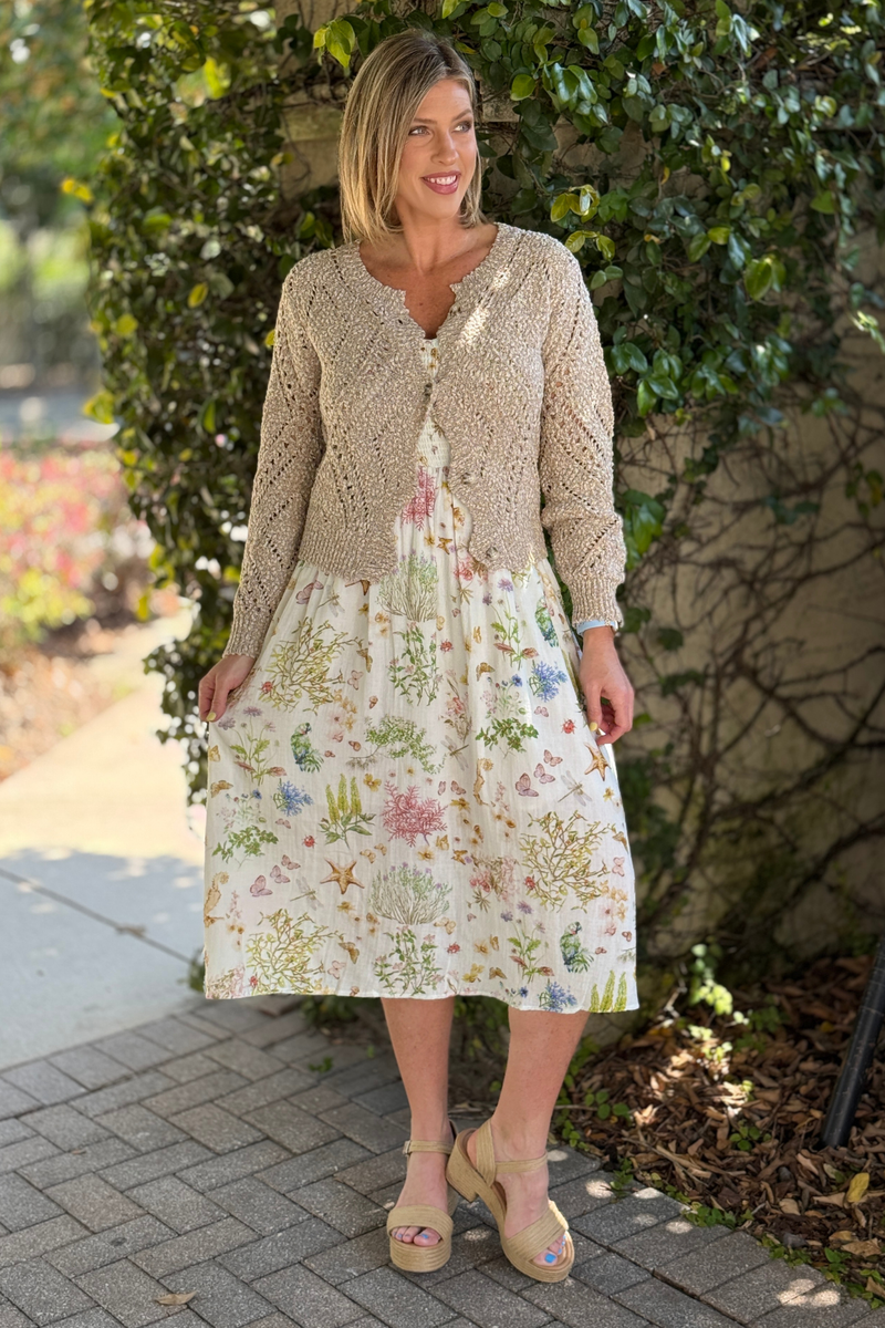 Lightweight neutral cardigan with bubble sleeves and button front