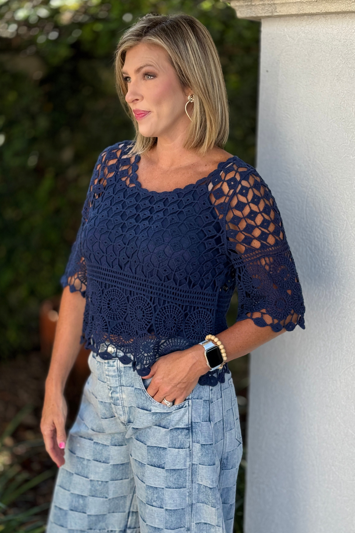 One size crochet top with short sleeves and relaxed fit