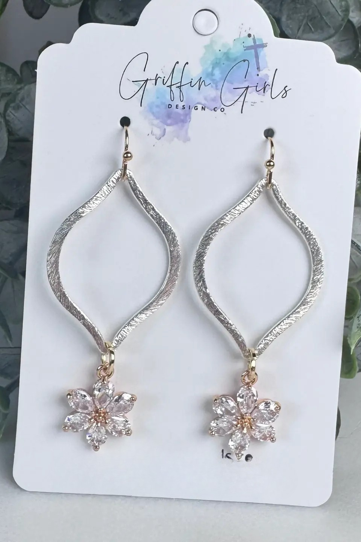 Silver oval drop earrings with crystal flower charm