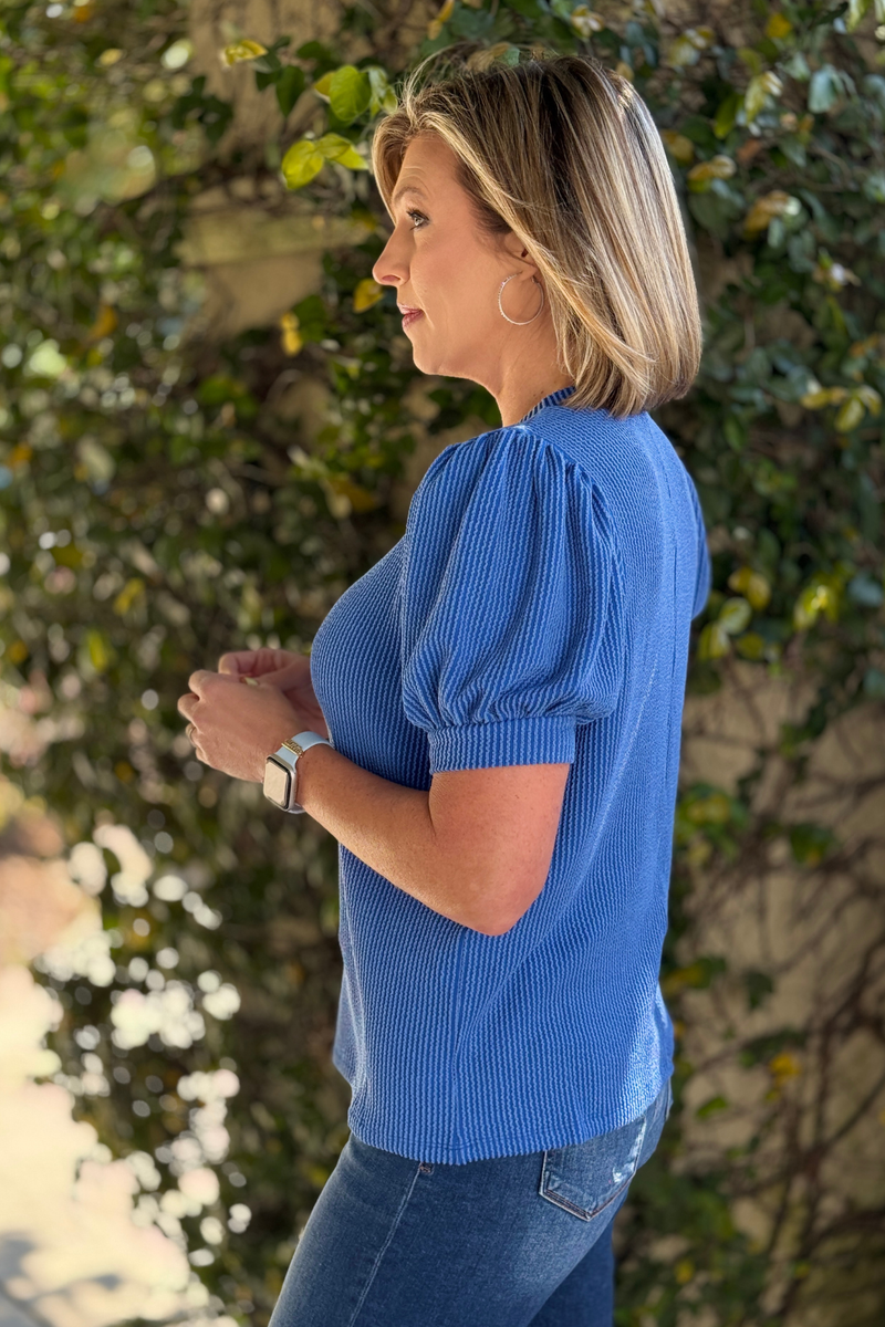 textured rib knit top with puff sleeves styled with jeans