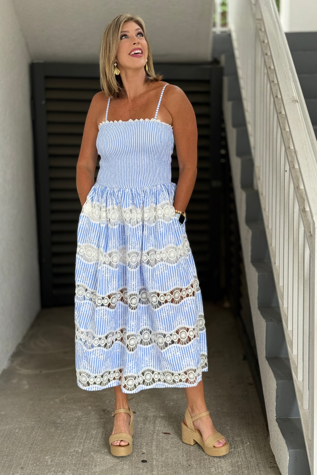 Coastal-inspired blue and white midi dress with smocked bodice
