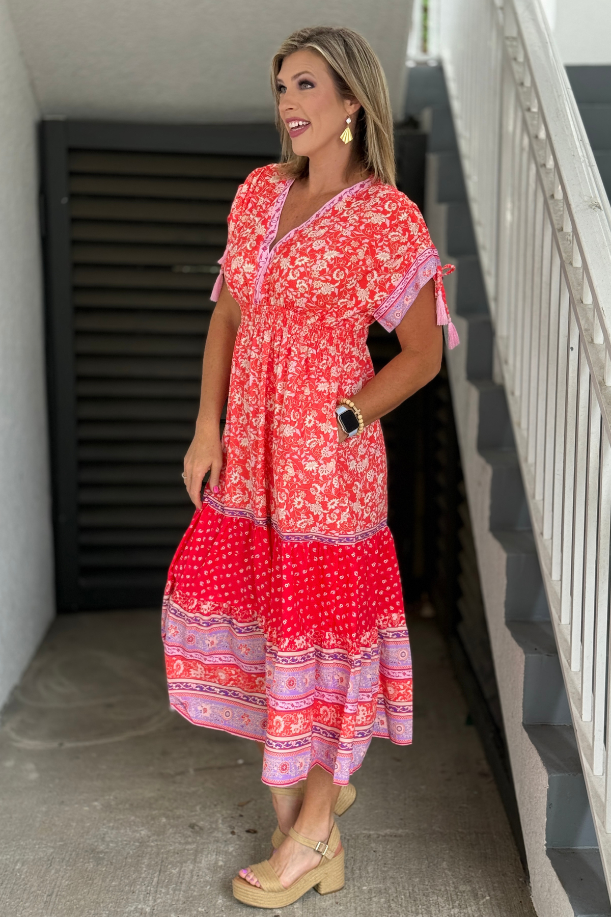 Boho-inspired floral dress with tasseled sleeve details
