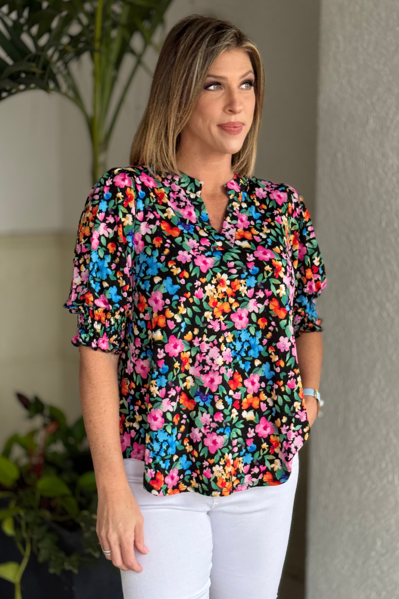 woman wearing floral Dear Scarlett TPN Collection top