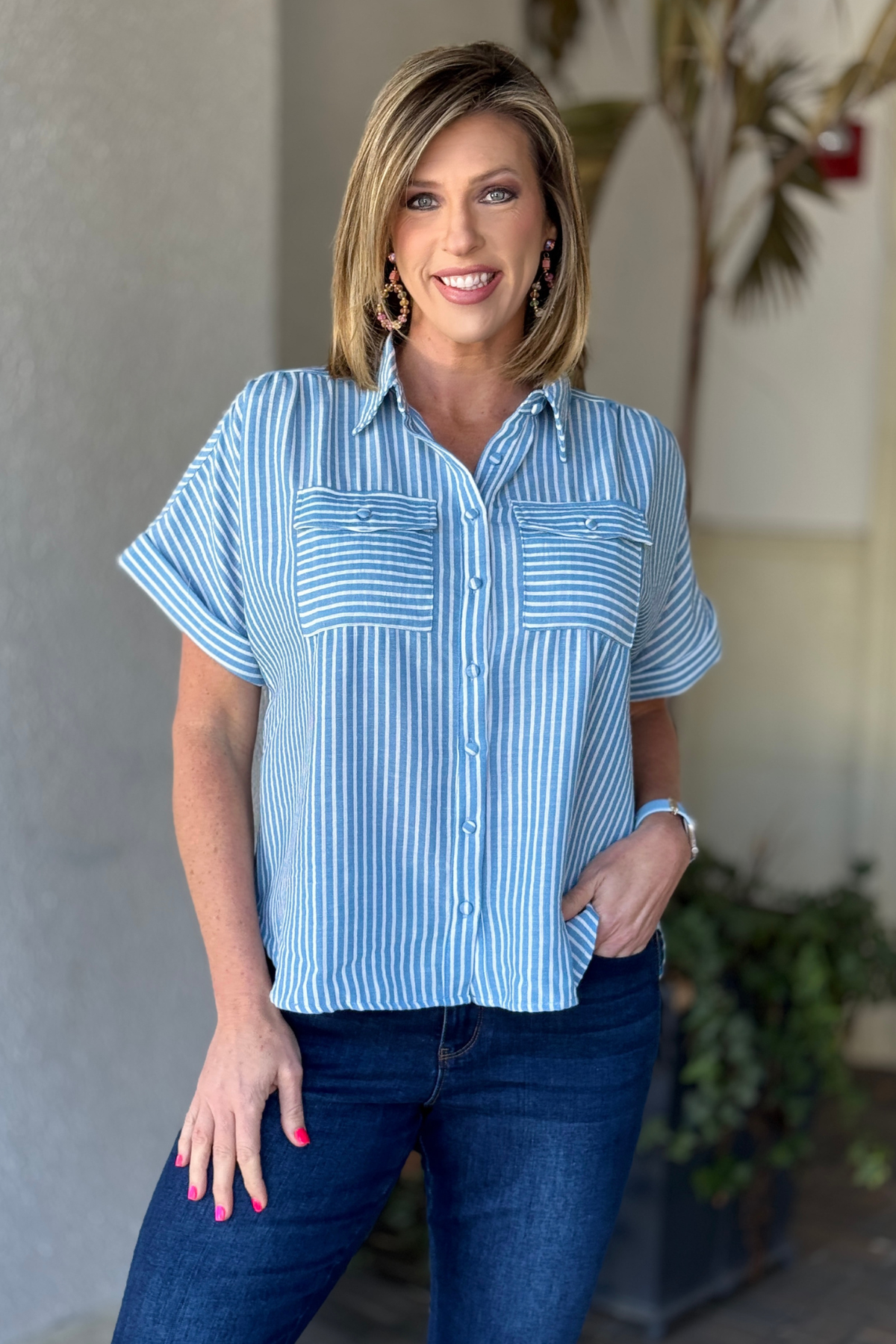Blue and white striped hi lo button down shirt front view