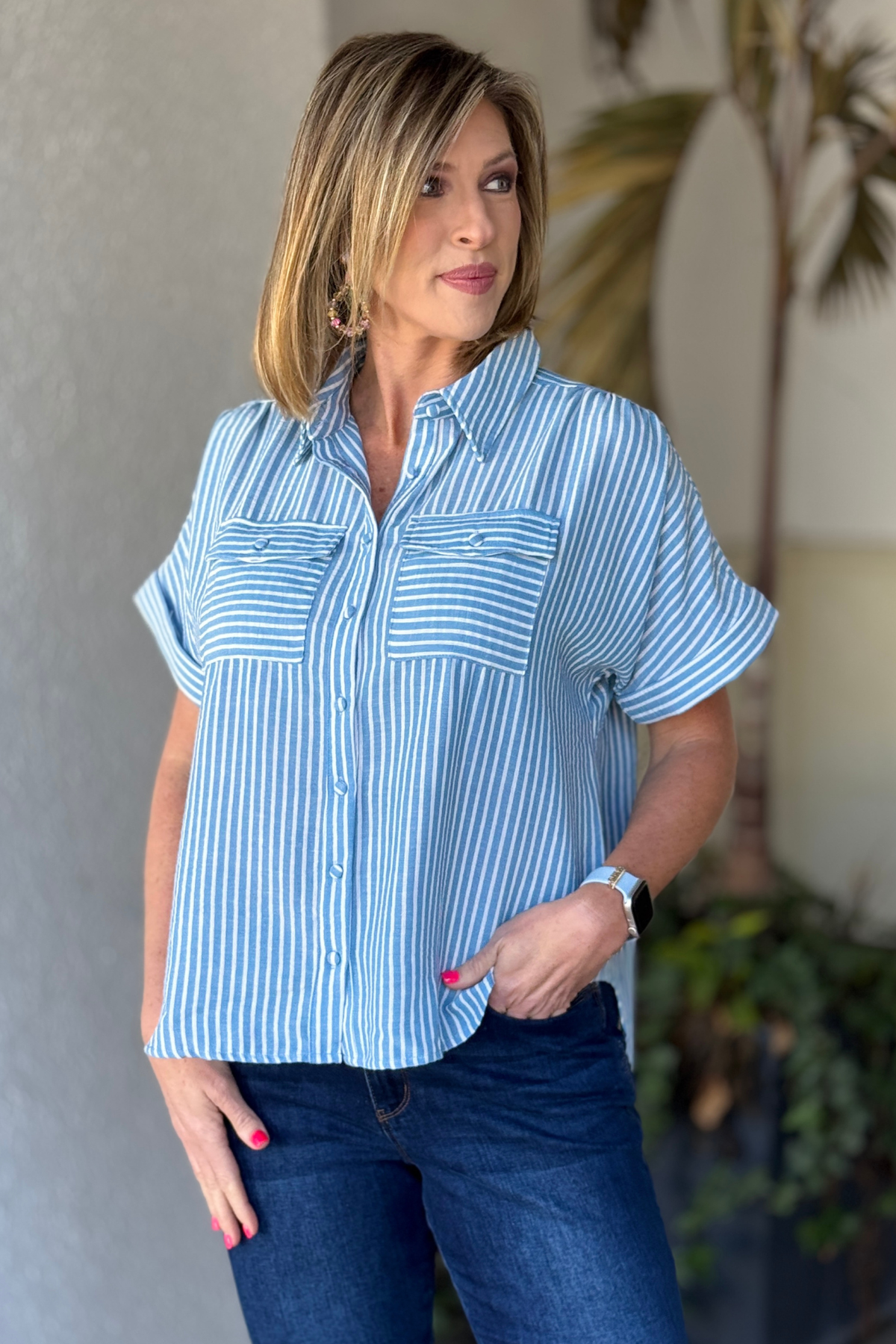 Side view of hi lo hem striped women’s top