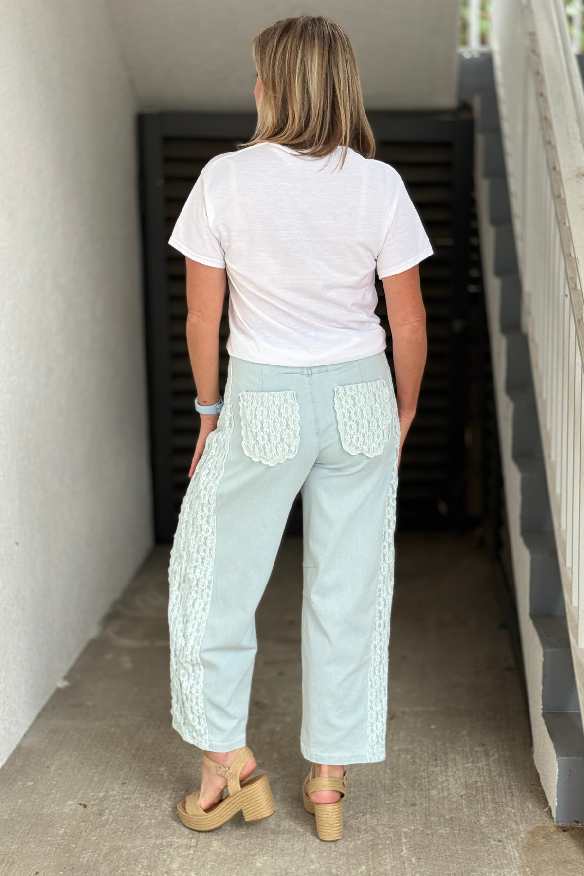 Feminine light wash denim with lace accents