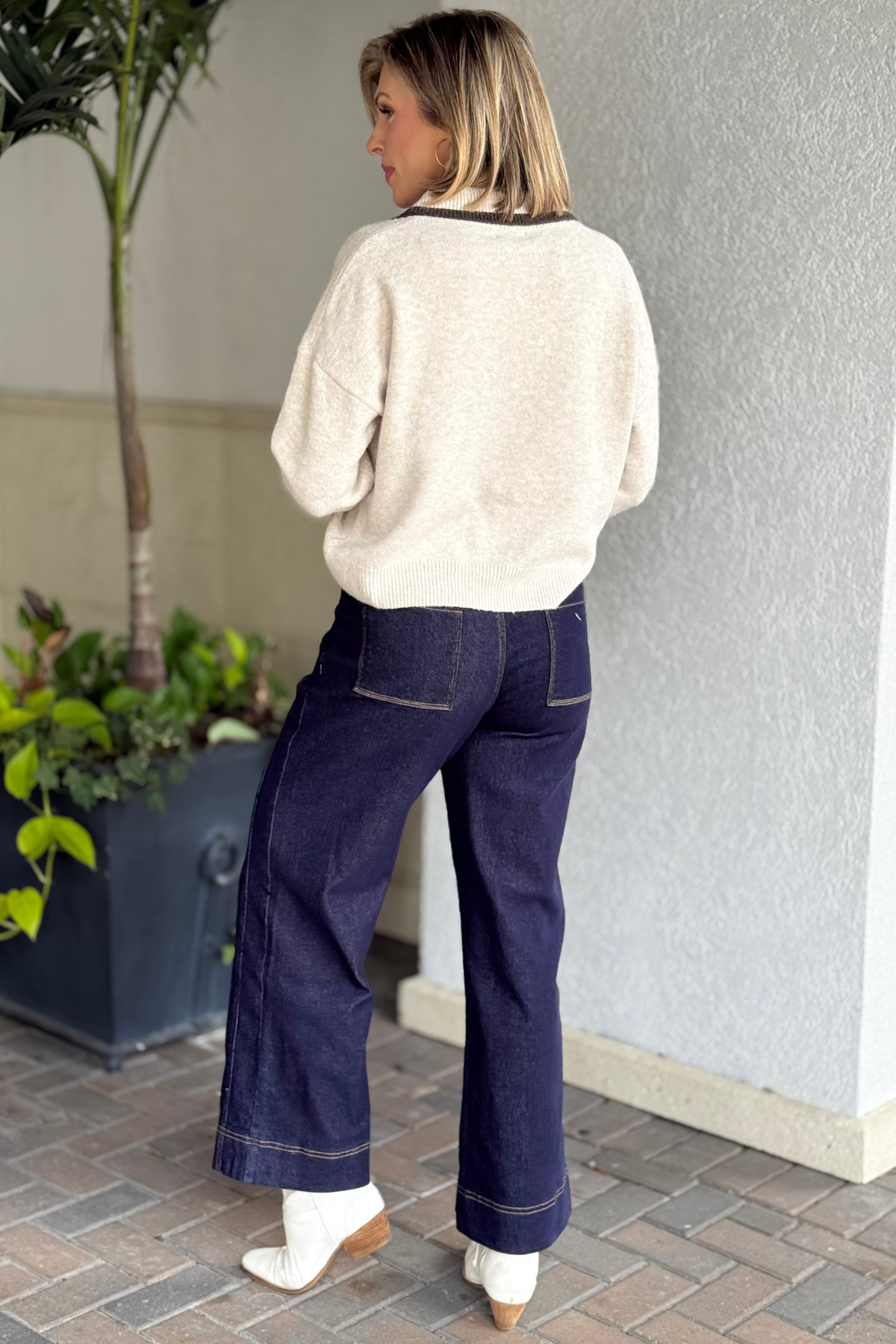 Contrast stitch dark wash denim pants flat front view