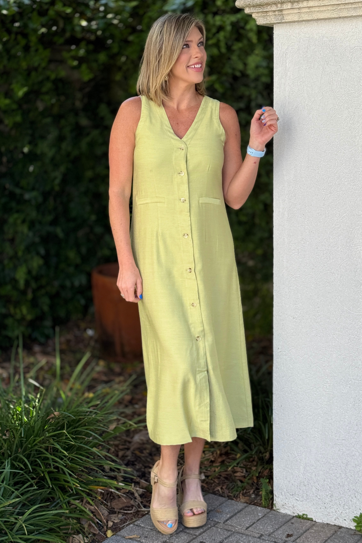 sage midi dress button front on model