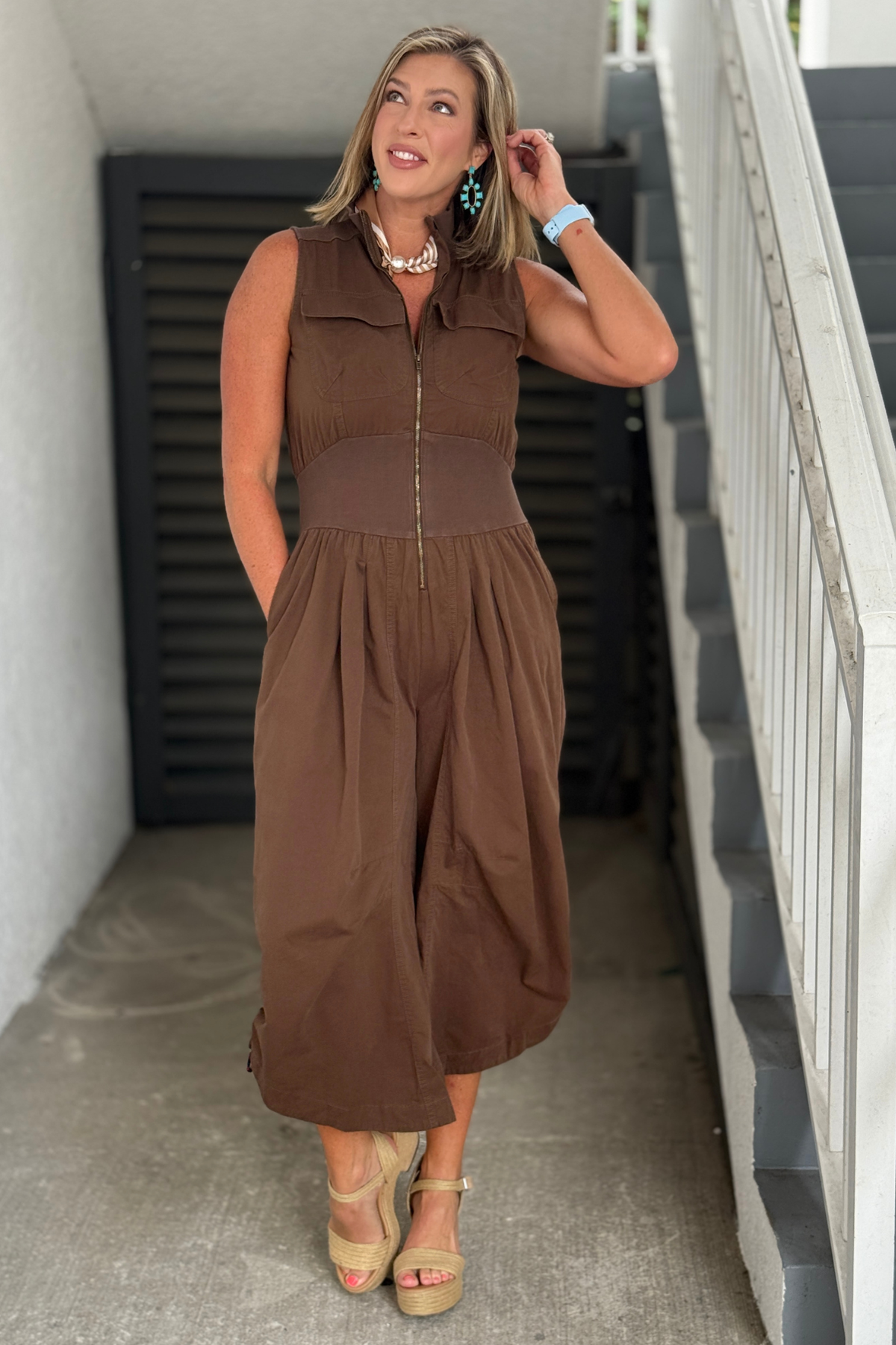 Mocha brown sleeveless utility jumpsuit.