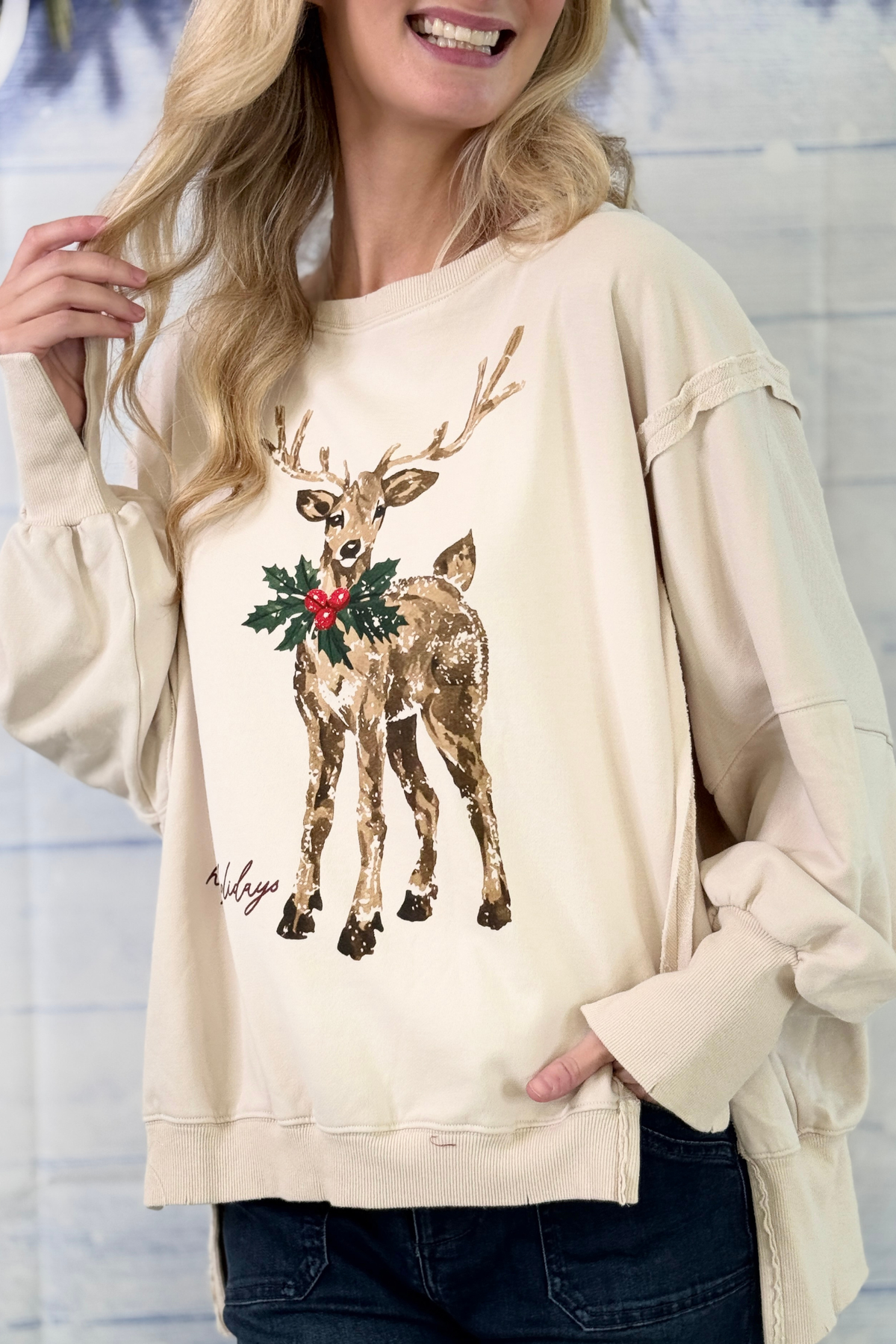 Cream Christmas sweatshirt with raw edge seams and volume sleeves
