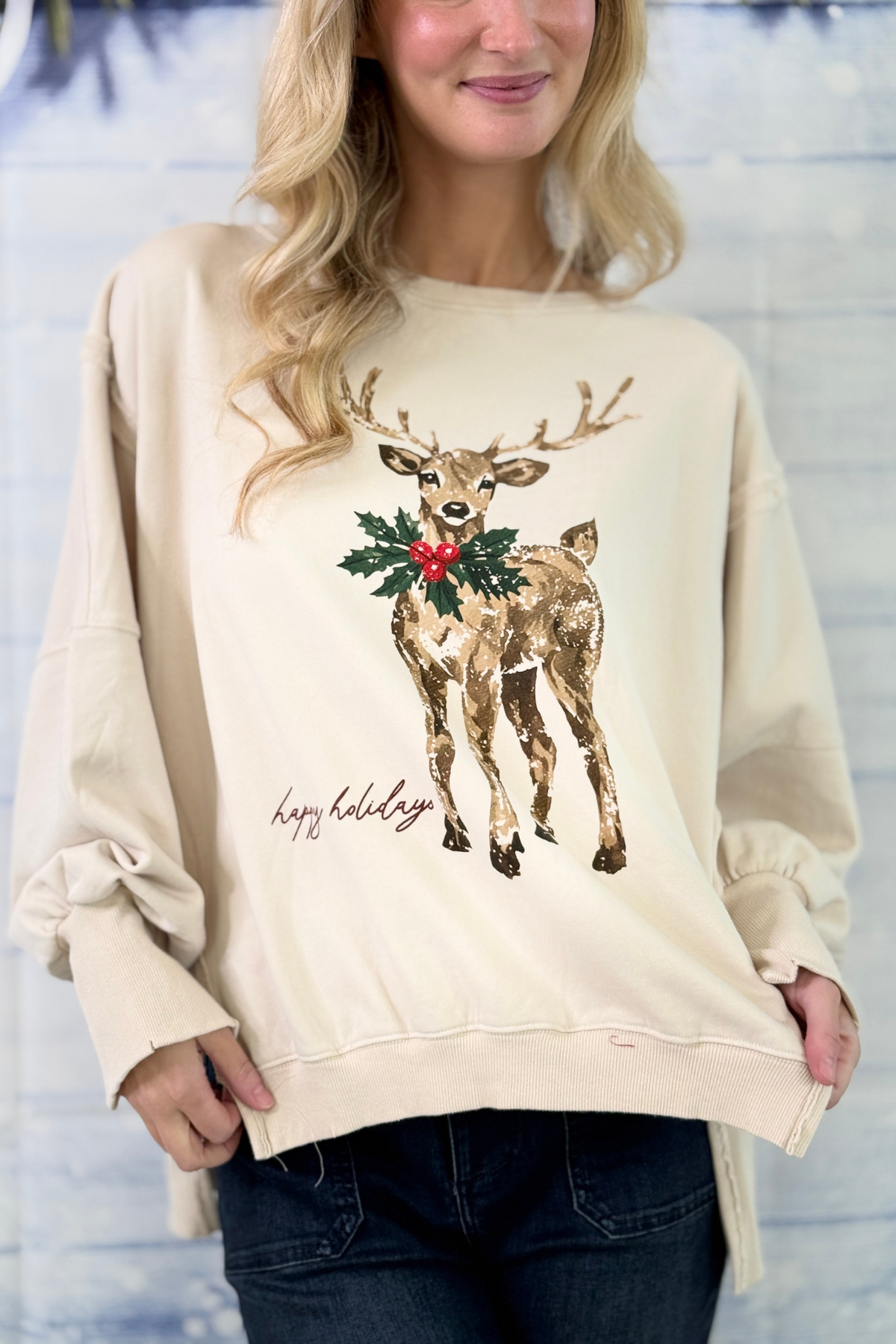 Oversized Christmas reindeer pullover in cream with holly graphic