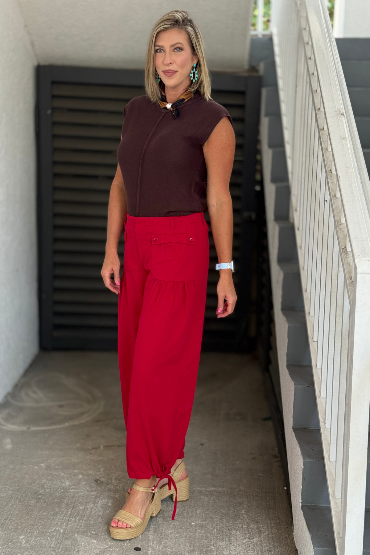Adjustable cuff red pants.