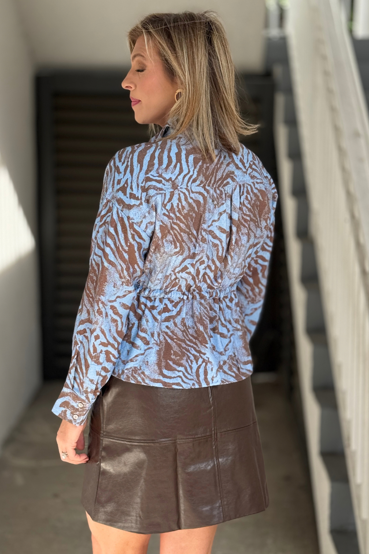 Lightweight blue and brown animal print button down top  
Women’s fall zebra blouse with gathered back detail