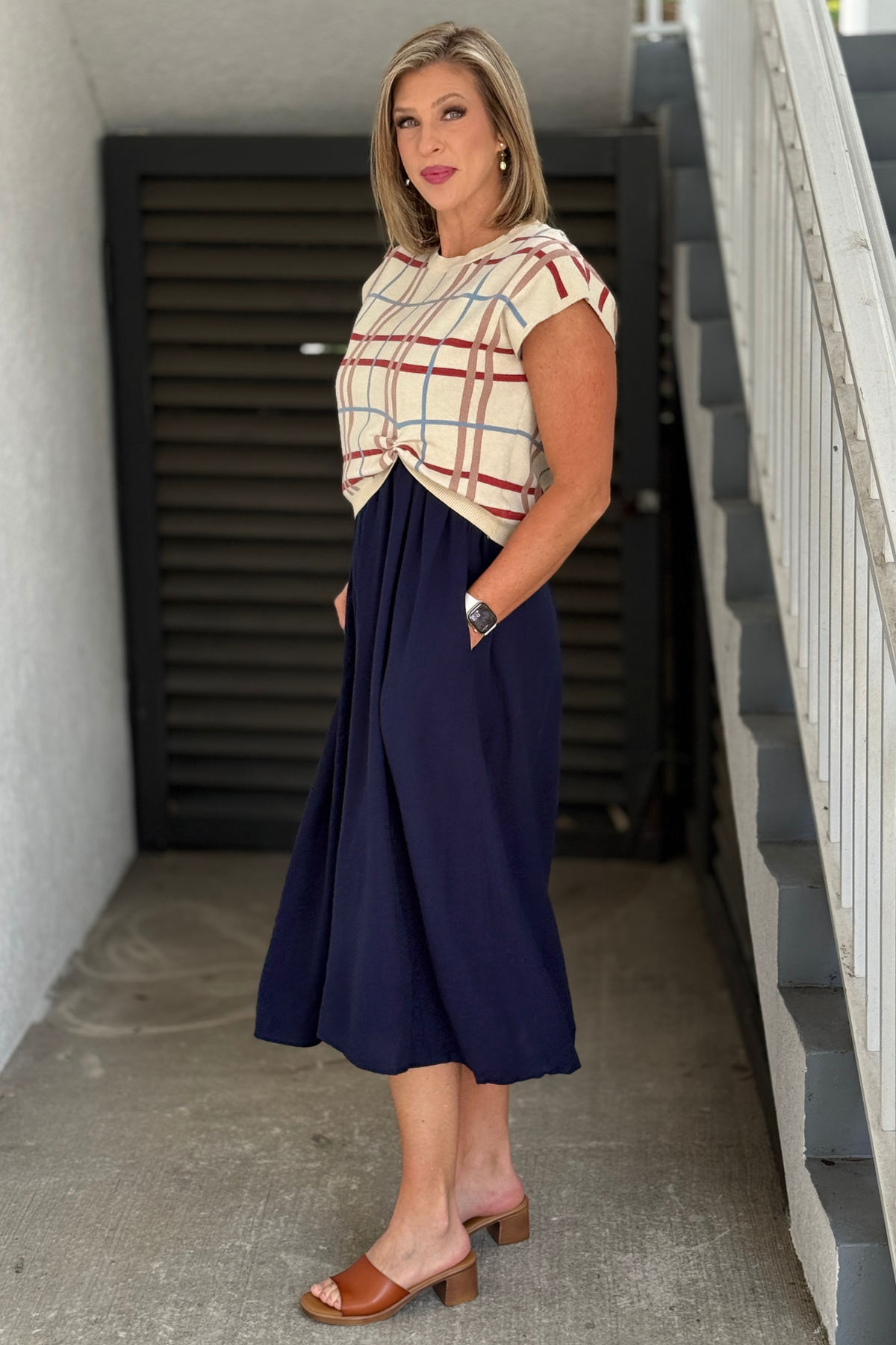 Women’s navy midi dress with pockets and plaid sweater layer
