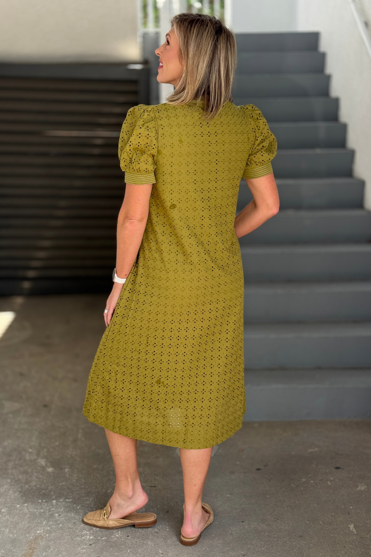 Lined olive eyelet dress with side pockets
Back view of olive eyelet midi dress
