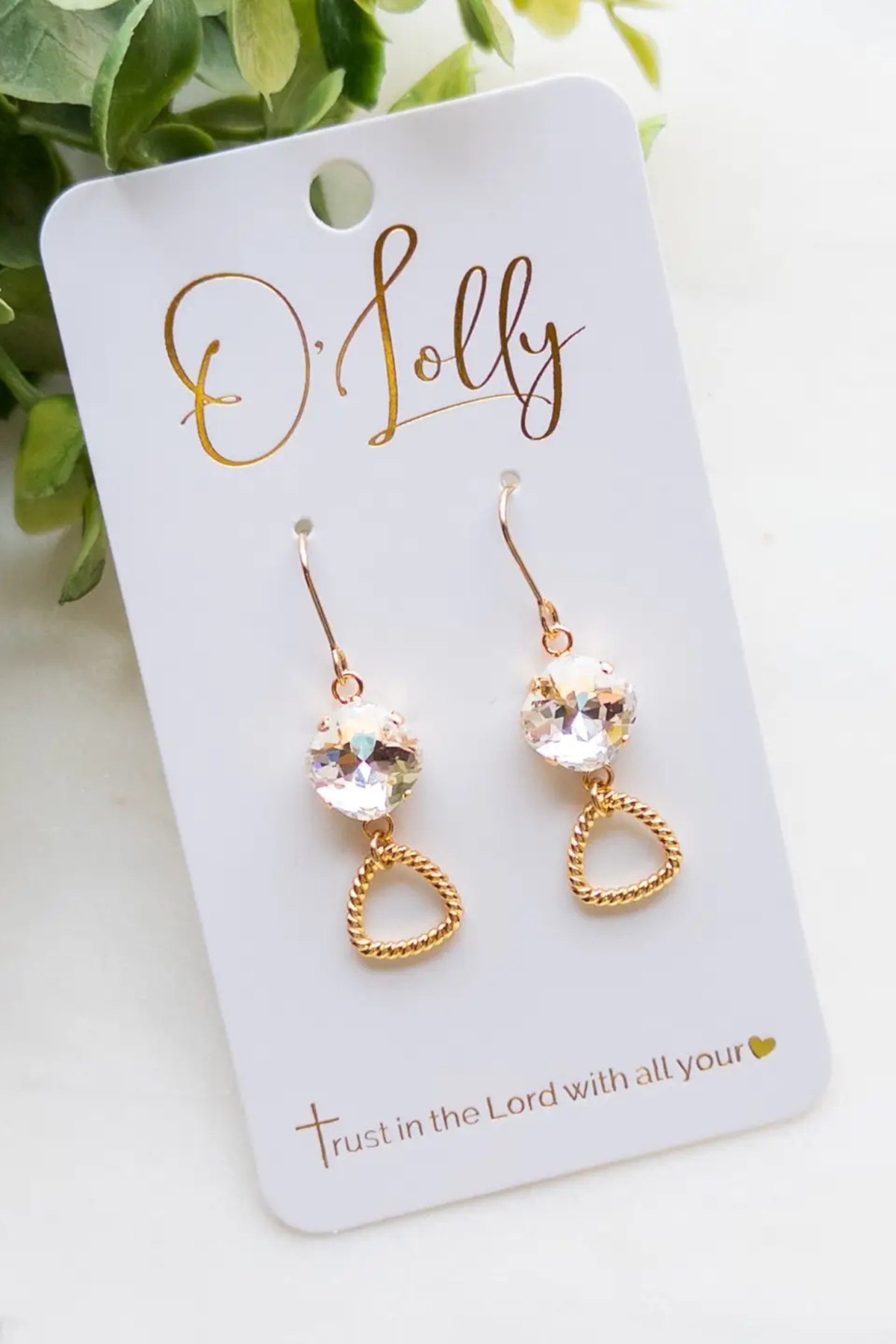 gold textured dangle earrings with clear stone