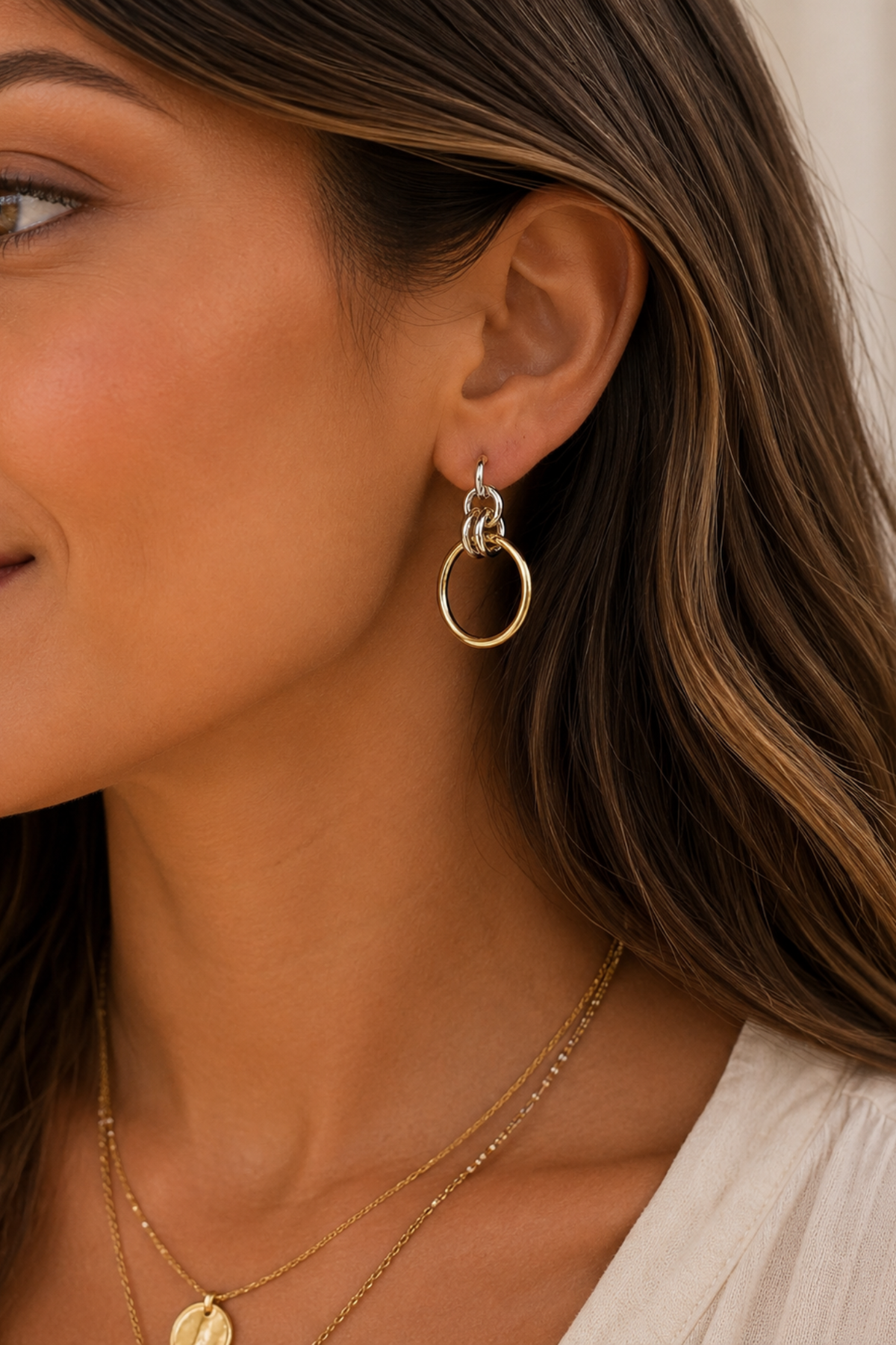 Mixed metal hoop earrings with gold and silver accents