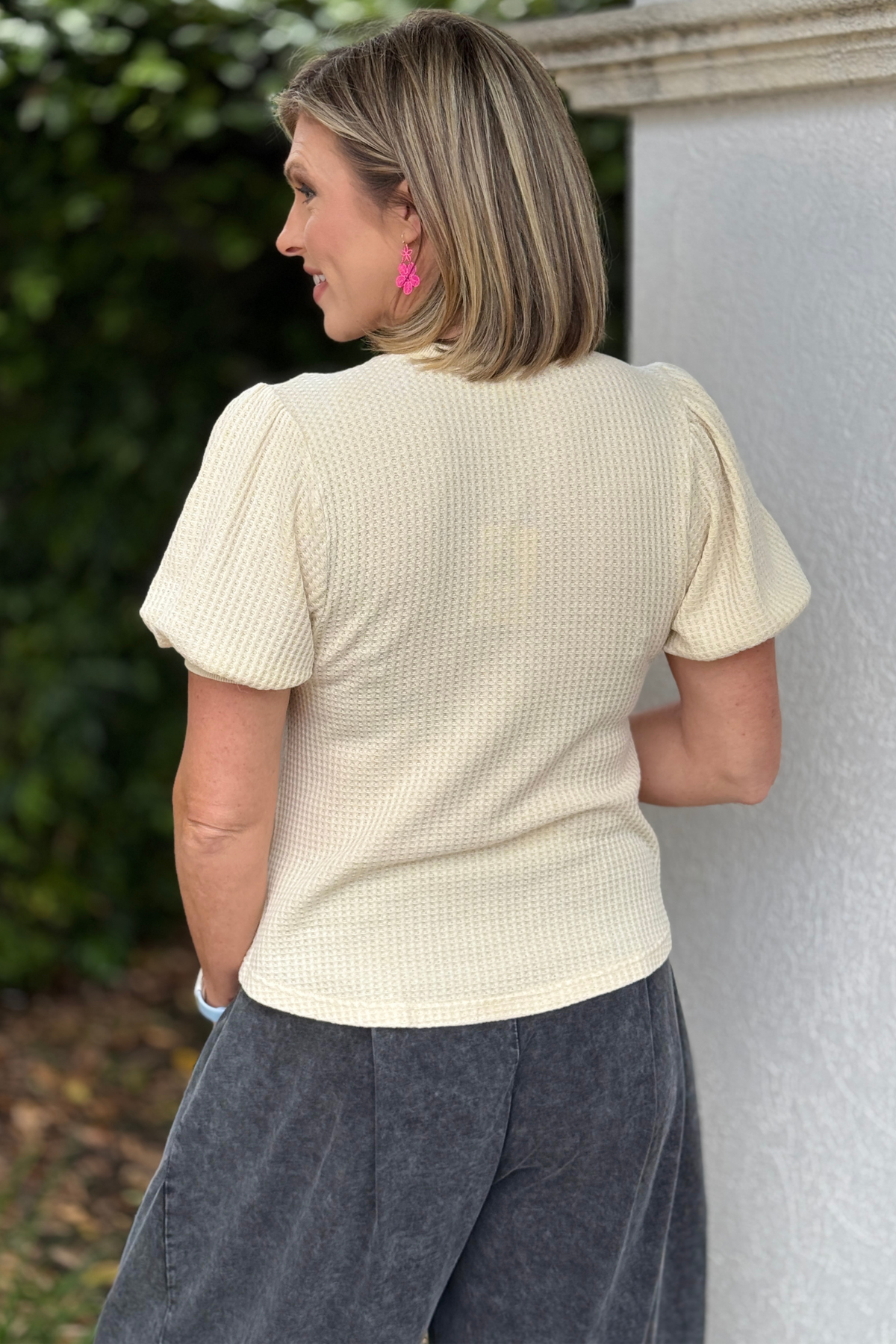 casual cream knit top styled with relaxed pants