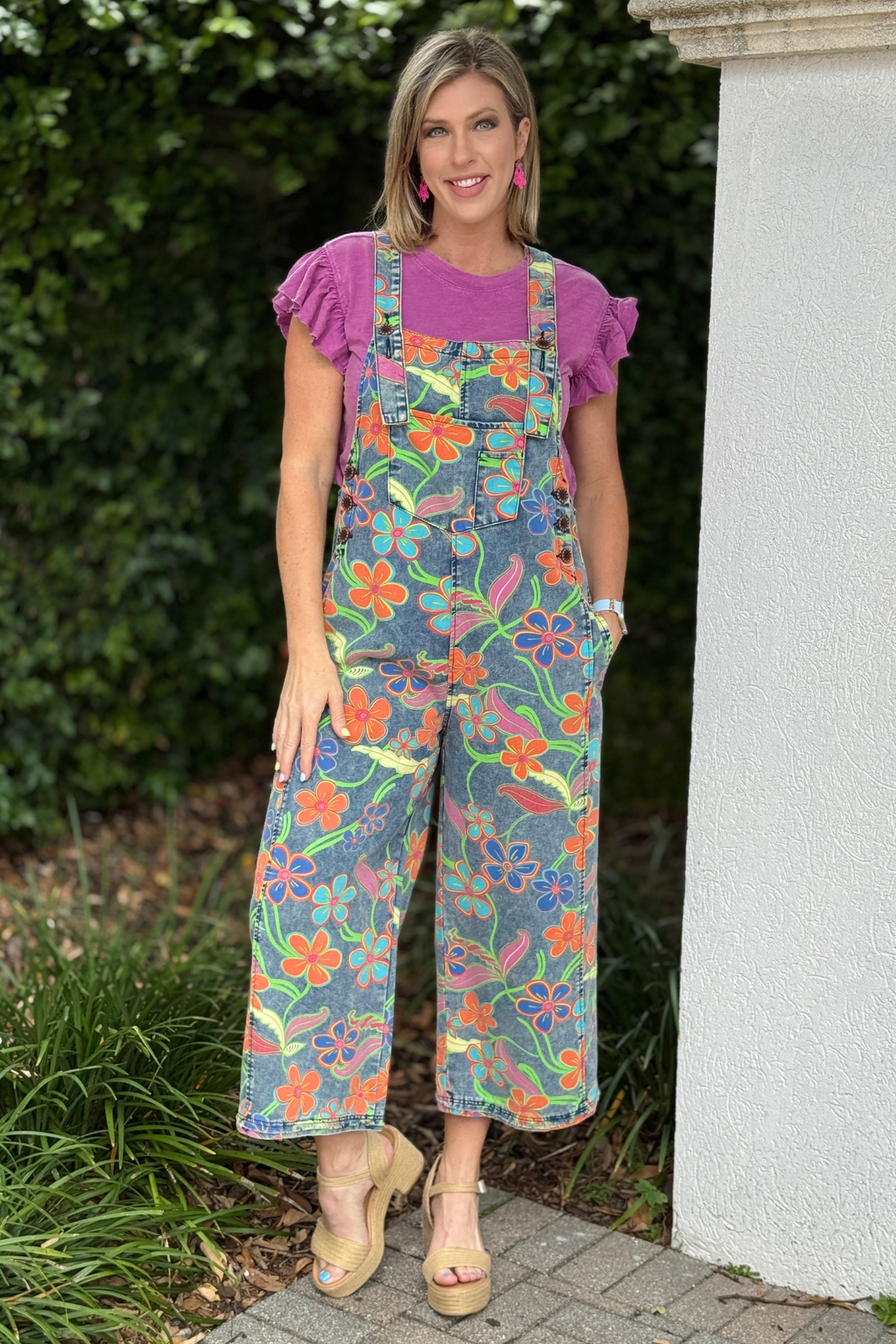 Back view of multicolor floral wide leg overalls