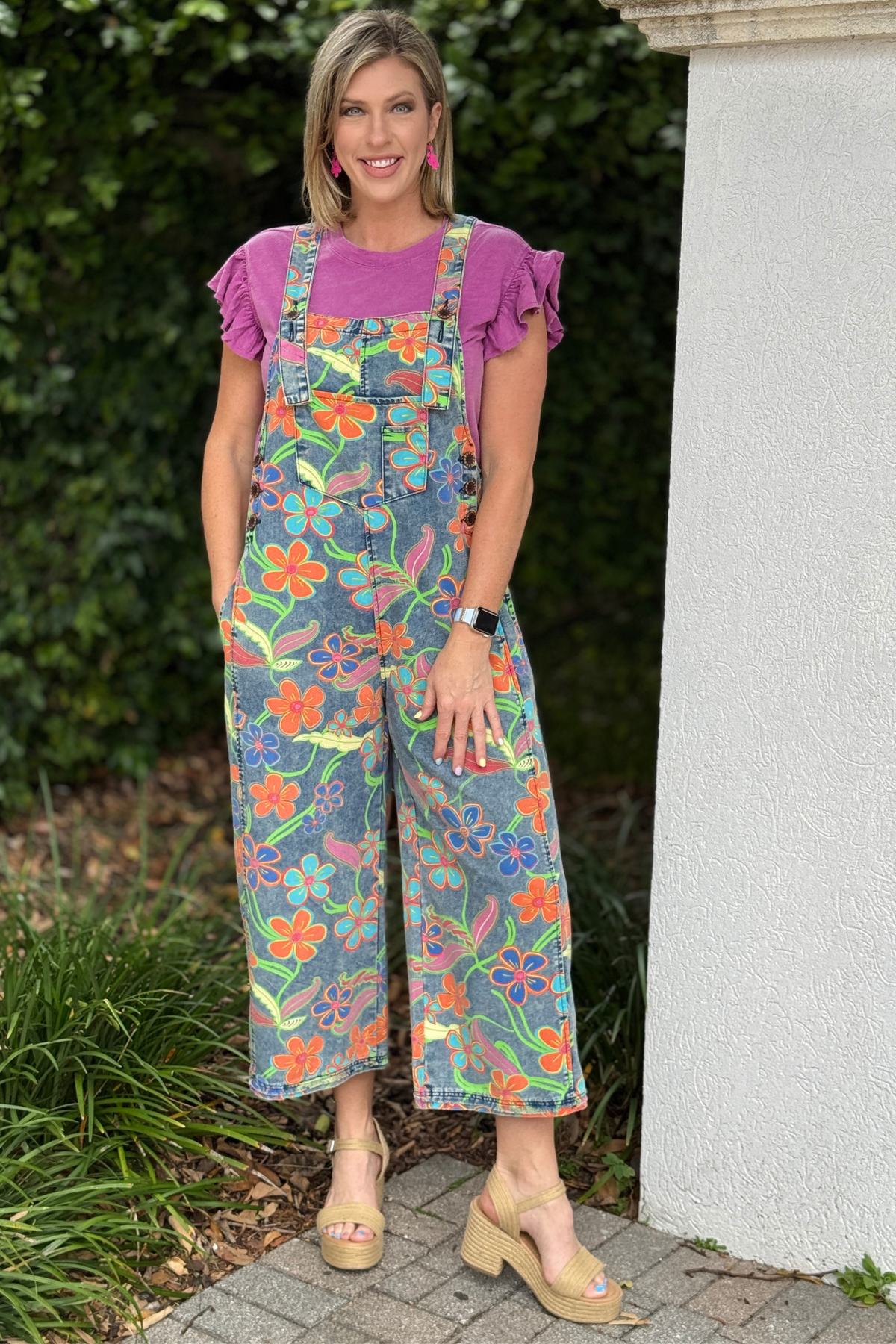 Colorful boutique overalls styled with pink top