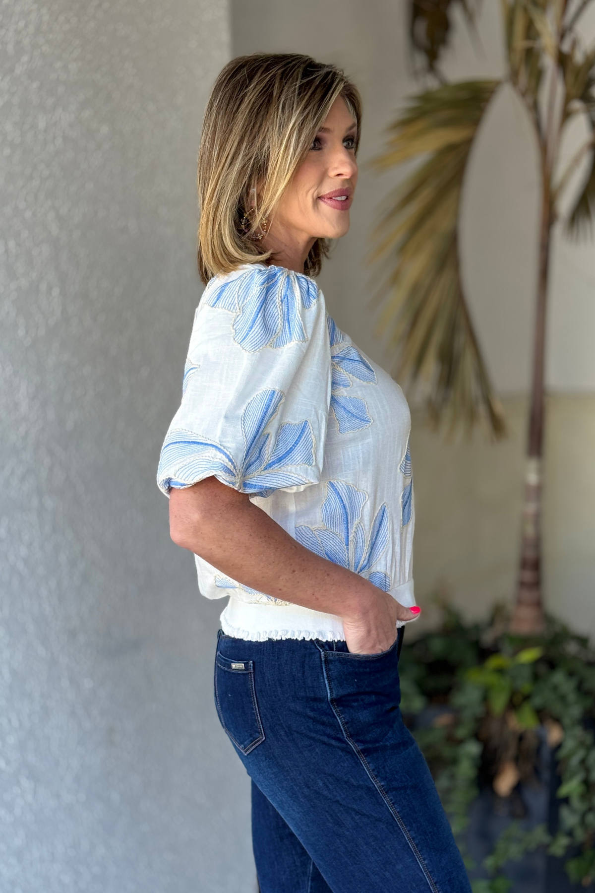 Side view of blue floral embroidery spring blouse