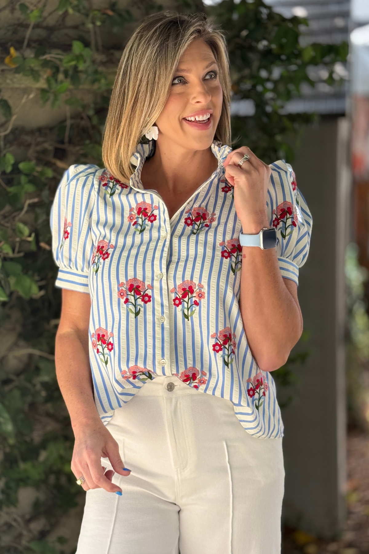 womens blue blouse with floral embroidery detail