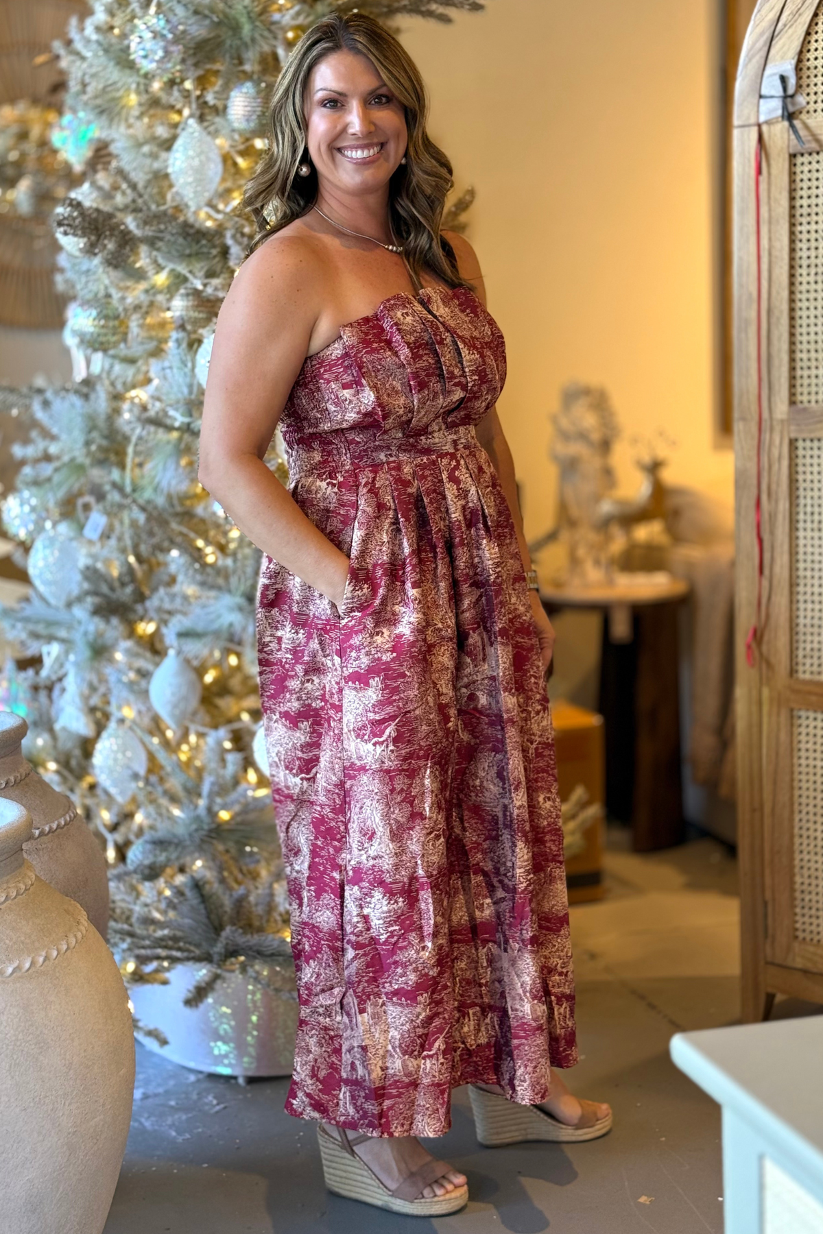 Side view of ivory jacquard strapless midi dress with castle and unicorn pattern.