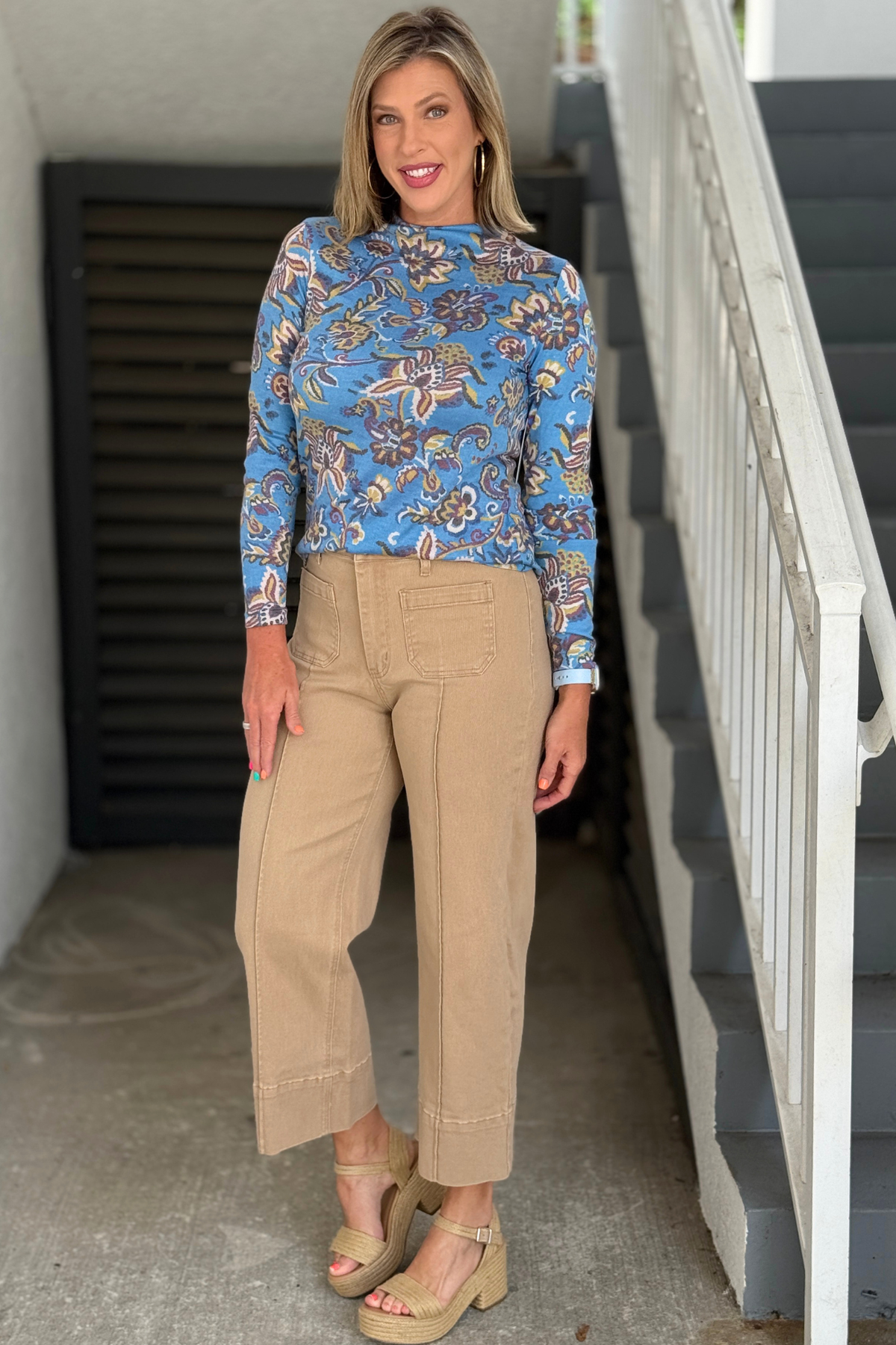 Women's camel pants styled with blue floral top