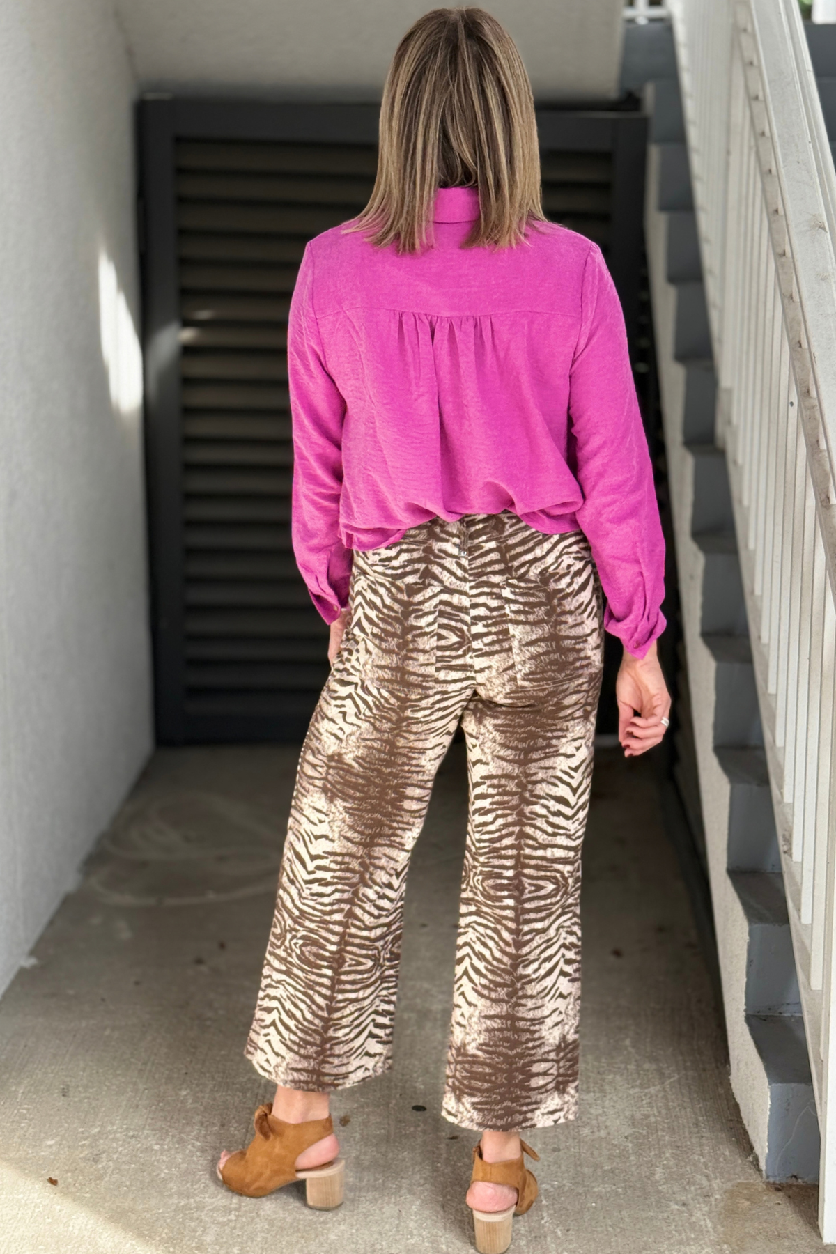 Mocha cream animal print pants styled with orchid top