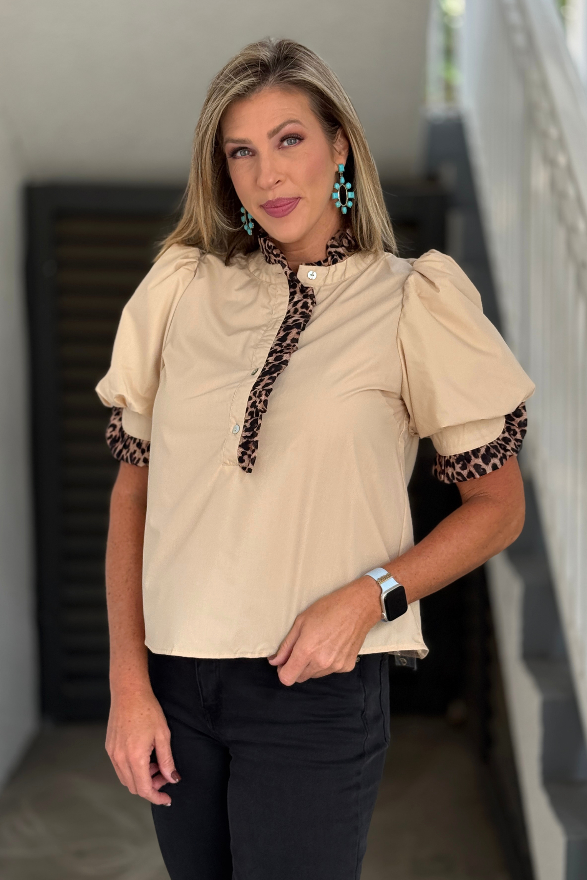 Women’s neutral top with leopard print trim