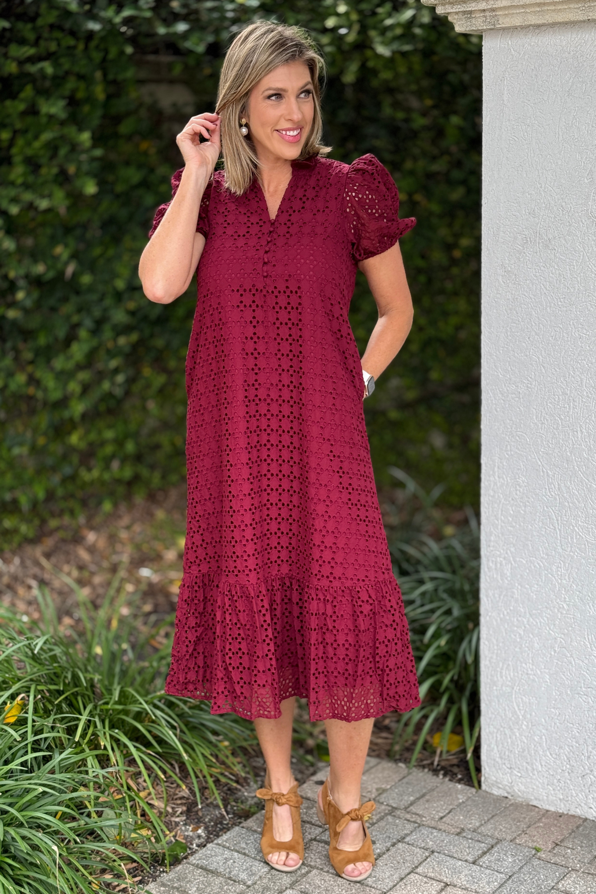 Christmas Cranberry Eyelet Midi Dress front view with puff sleeves and ruffle hem  