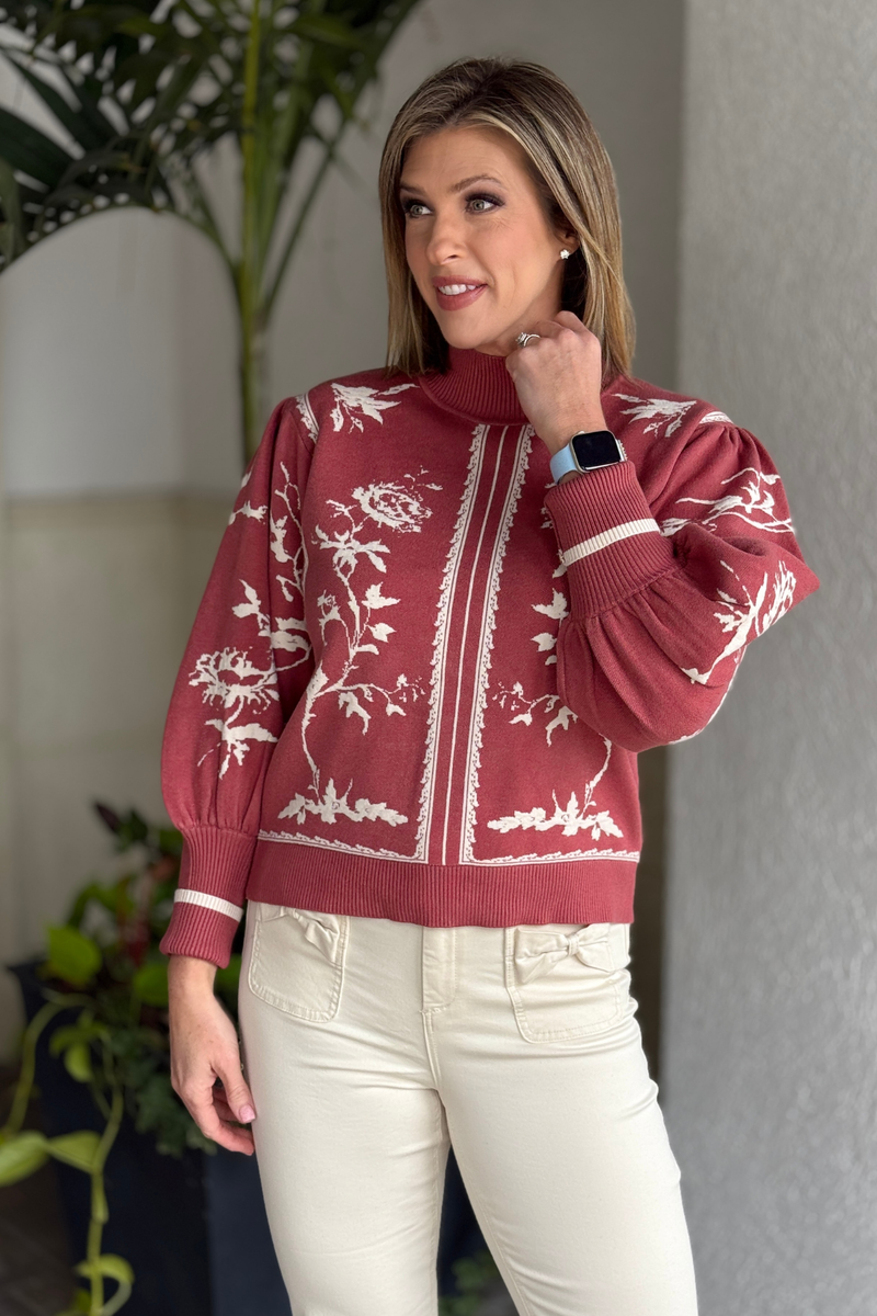 Red bean sweater styled with cream twill pants