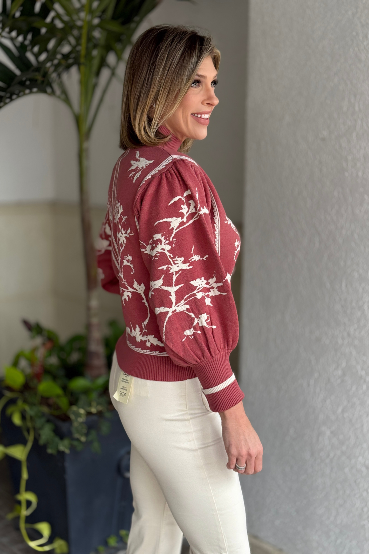 Red bean sweater paired with neutral pants outfit